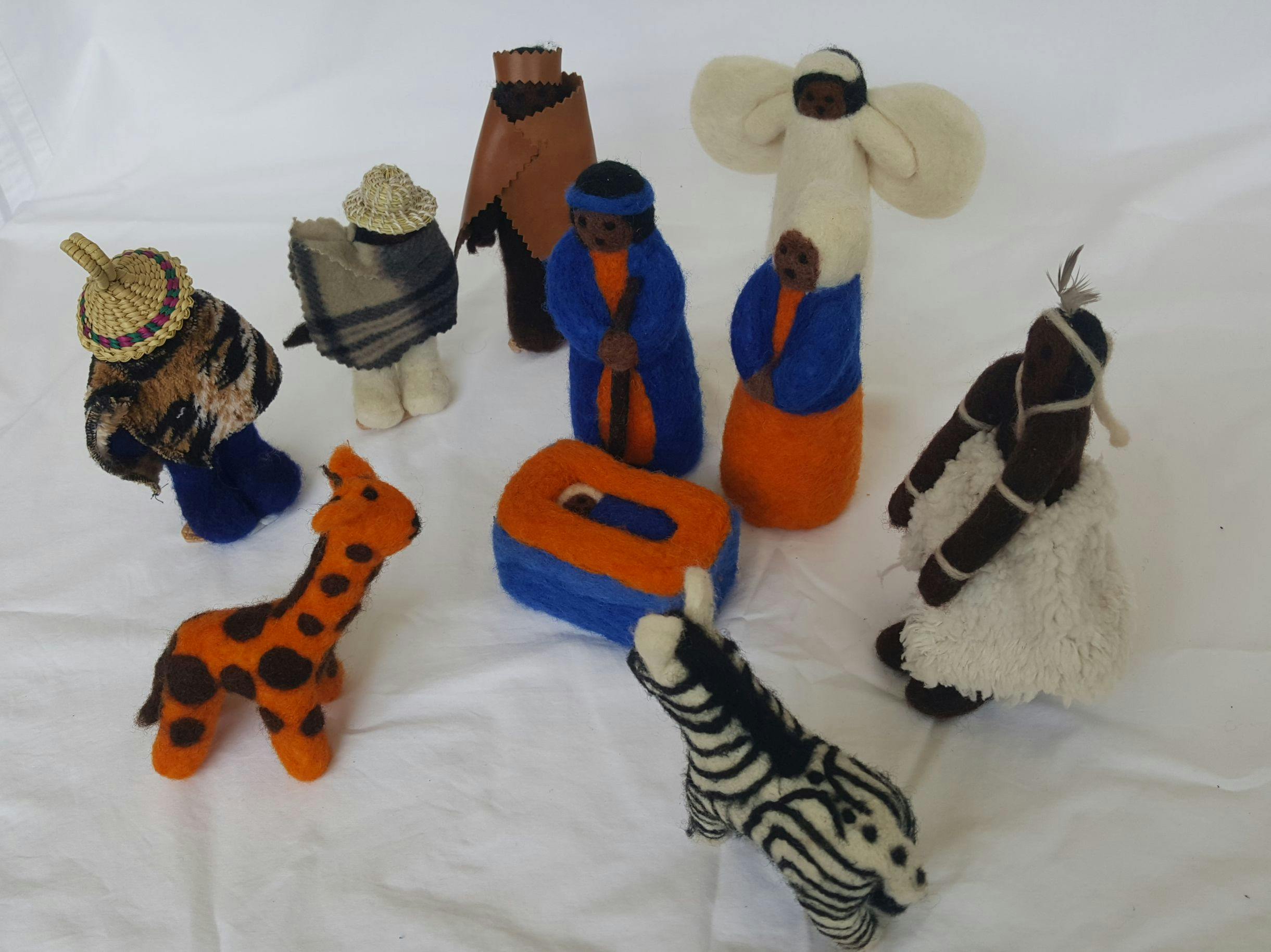 Felt figures in bright colours, including a giraffe and a zebra