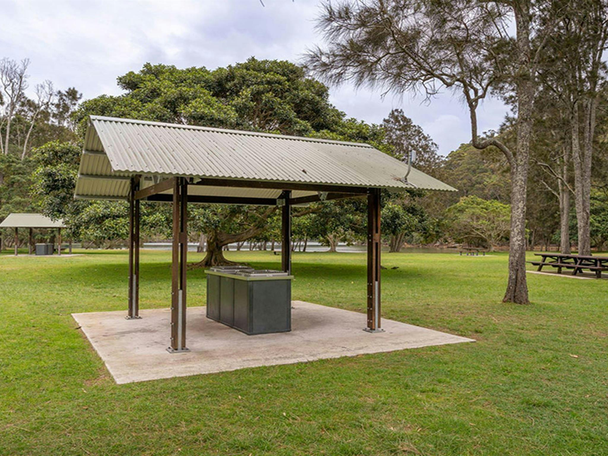 Sheltered barbecues and open picnic tables at The Basin campground. Credit: John Spencer/DCCEEW