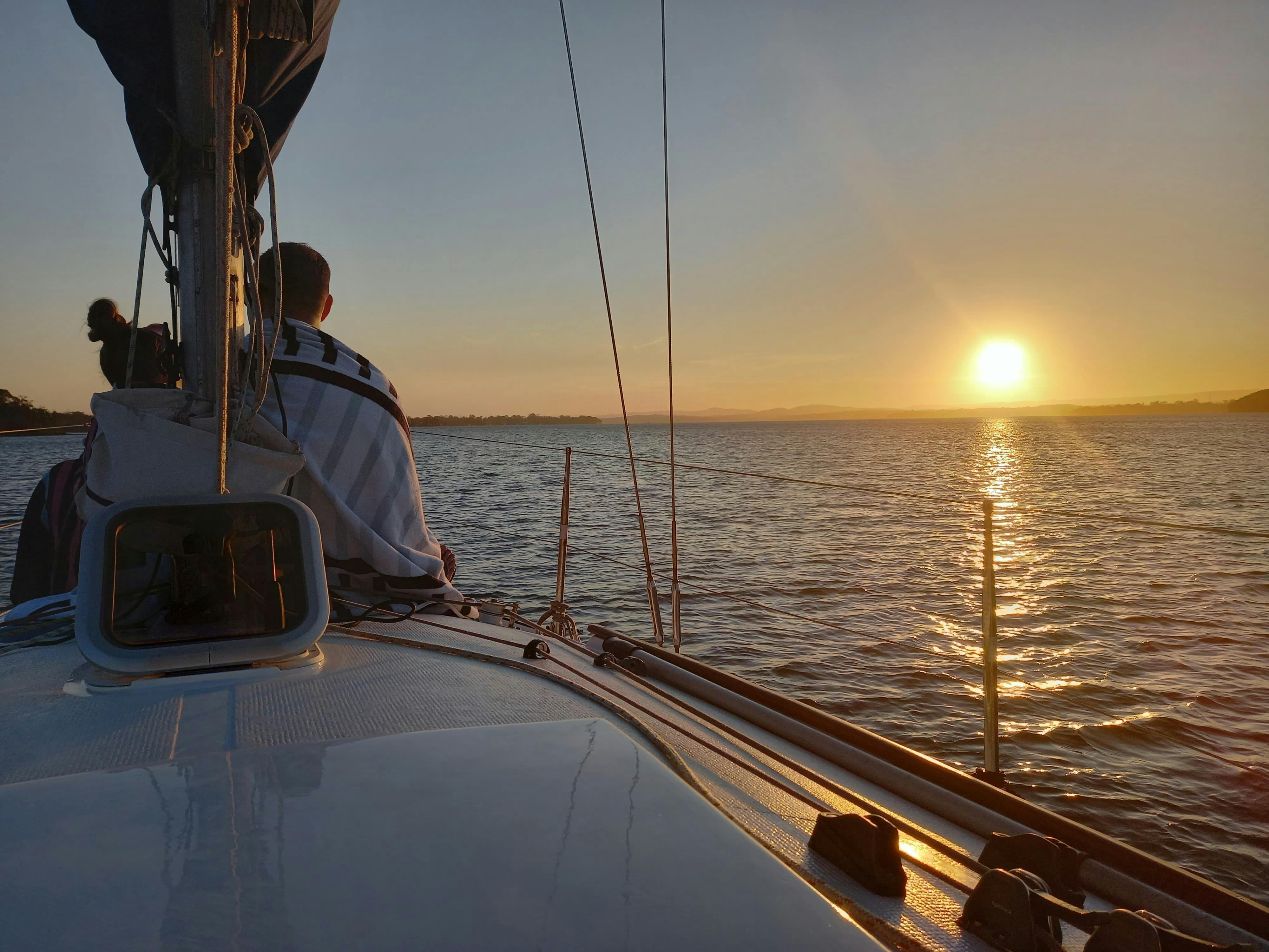 Couple enjoying the sunset tour of Lake Macquarie