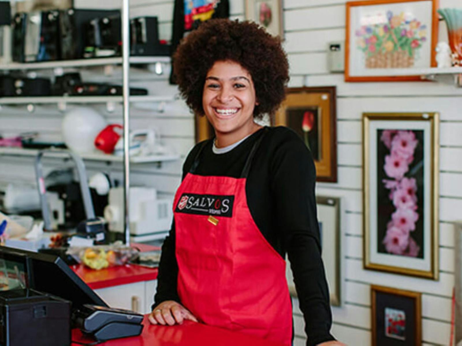 Image of a Salvation Army volunteer at the cash register