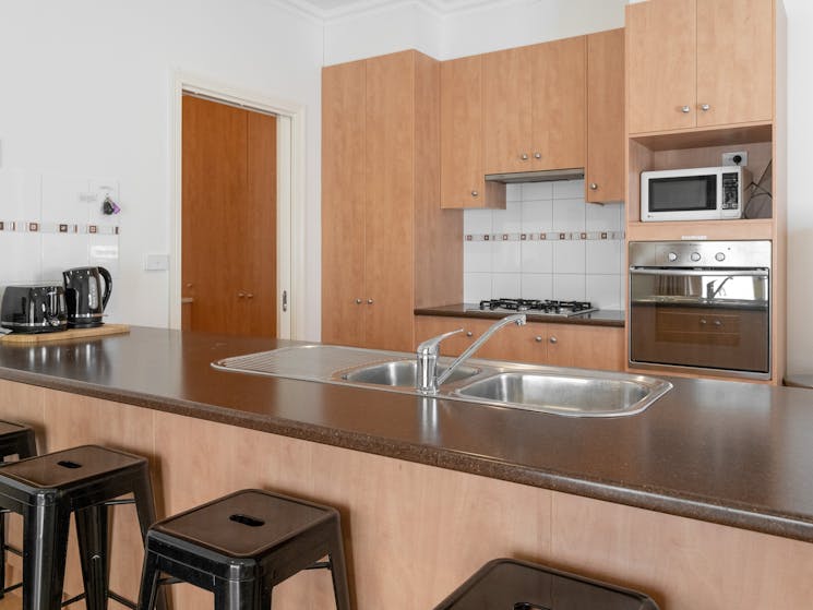 Townhouses boast large kitchens with room to cook and chat. Gas Stove and cooktop
