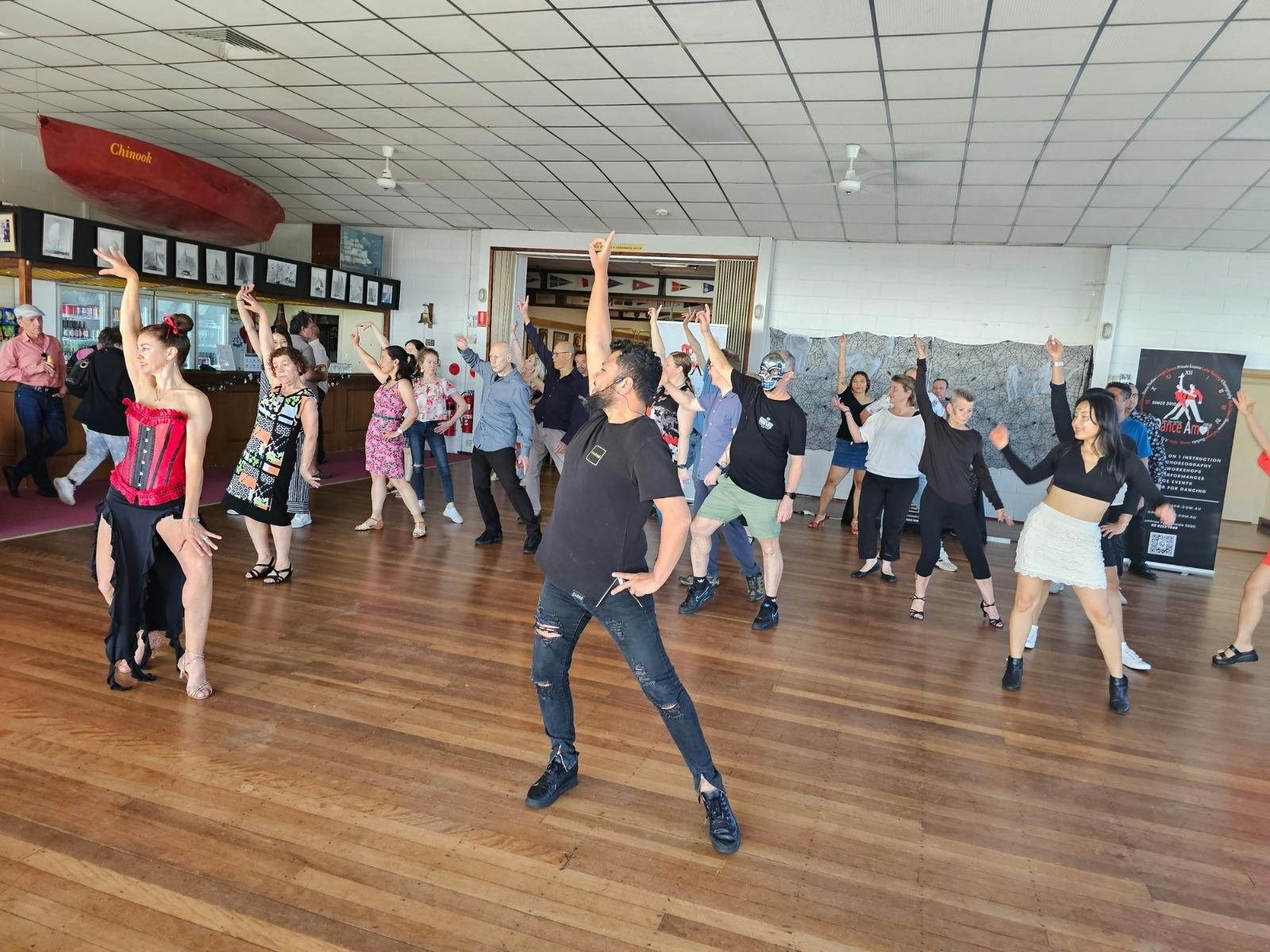 People learning dancing at our Salsa by the Sea Event