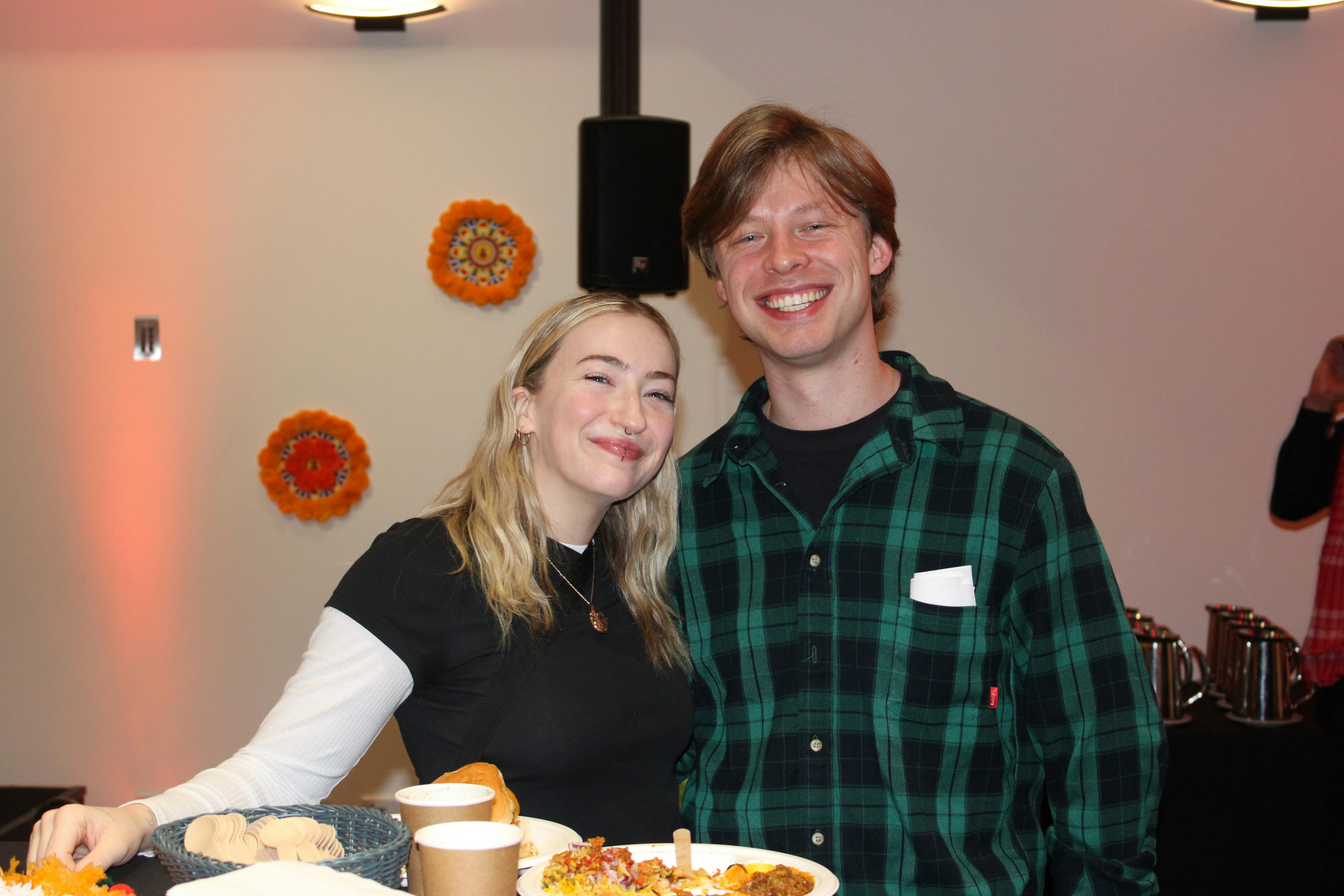 a couple enjoying the food and the eventt