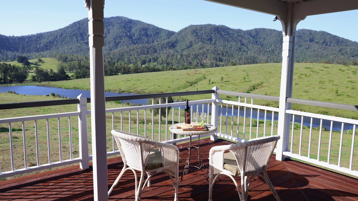 Wrap-around verandah with views of the dam and mountains