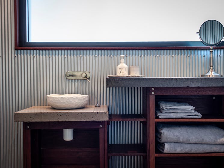 Bathroom features purpose-built vanity and commissioned ceramics.