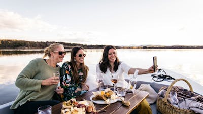 Three women taking a selfie on a boat