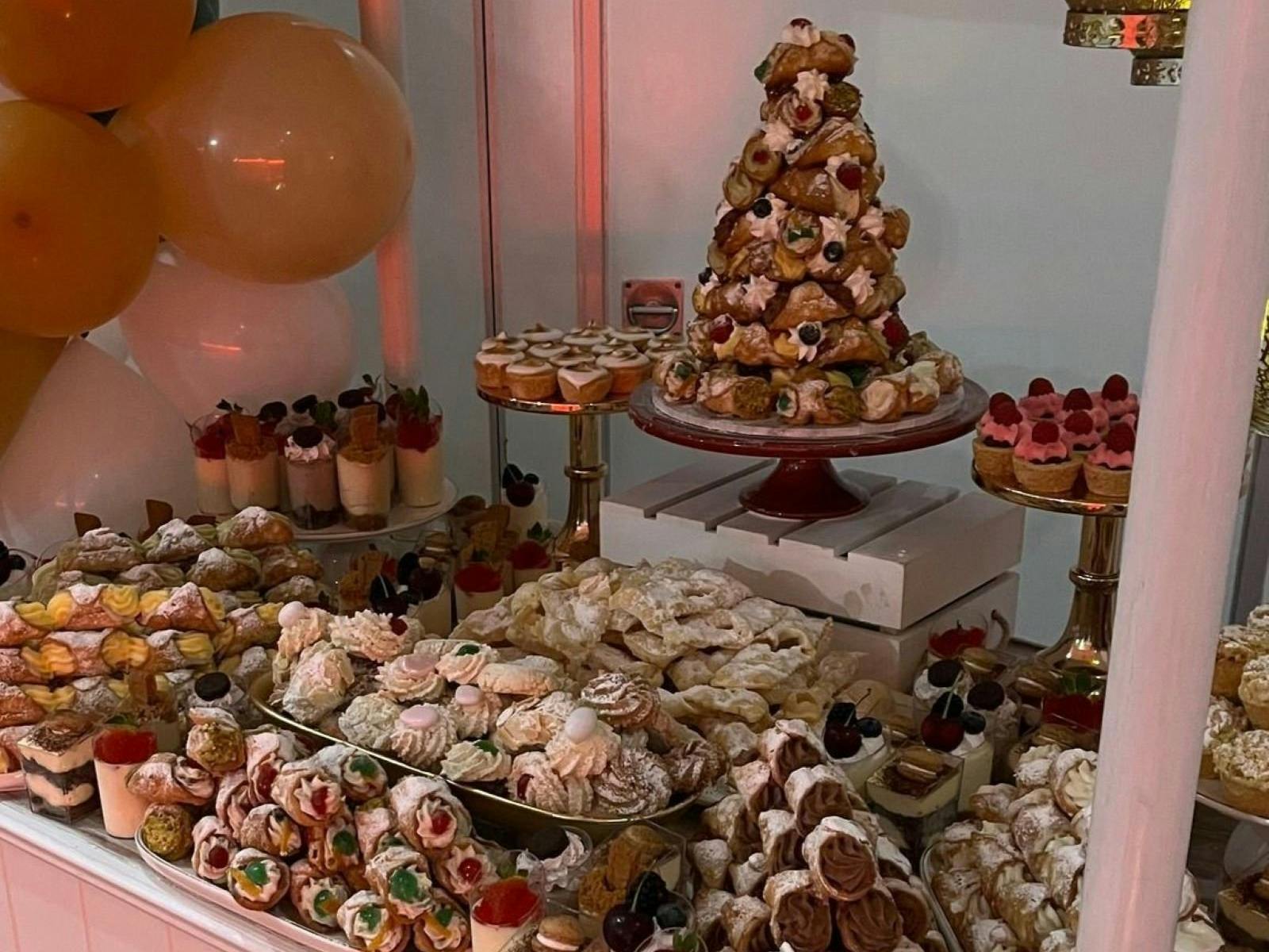 A cart with lots of different desserts on it