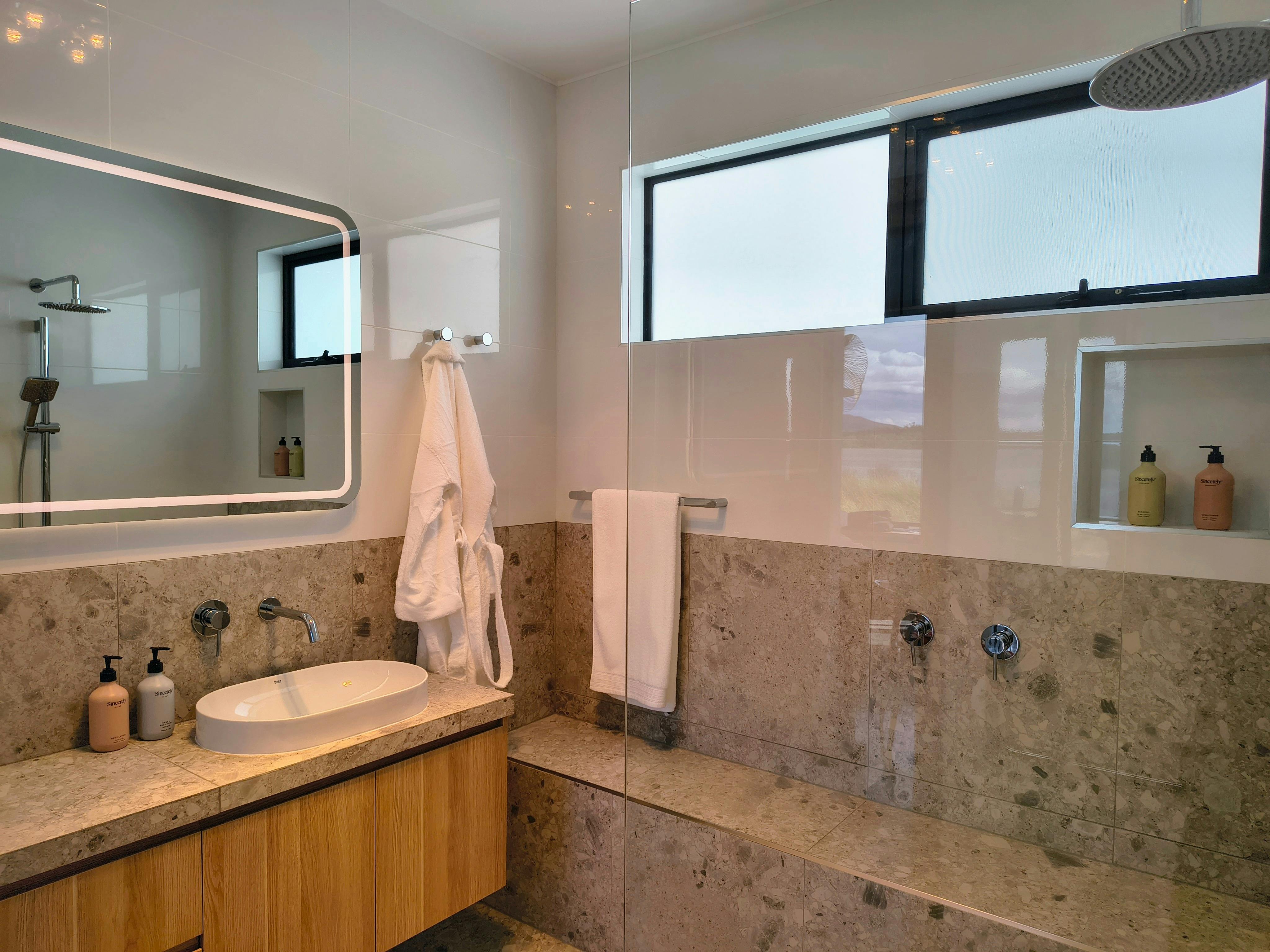 Spacious bathroom with accessibilty in mind without the loss of day spa vibes