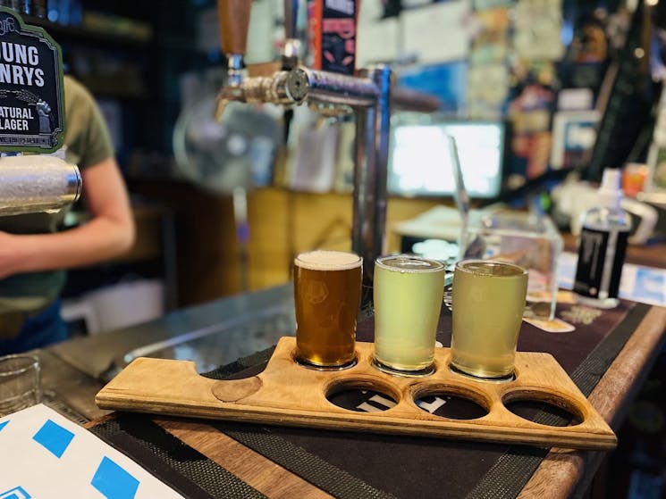 Enjoy a shared tasting paddle of craft beers at the always popular Young Henrys brewery