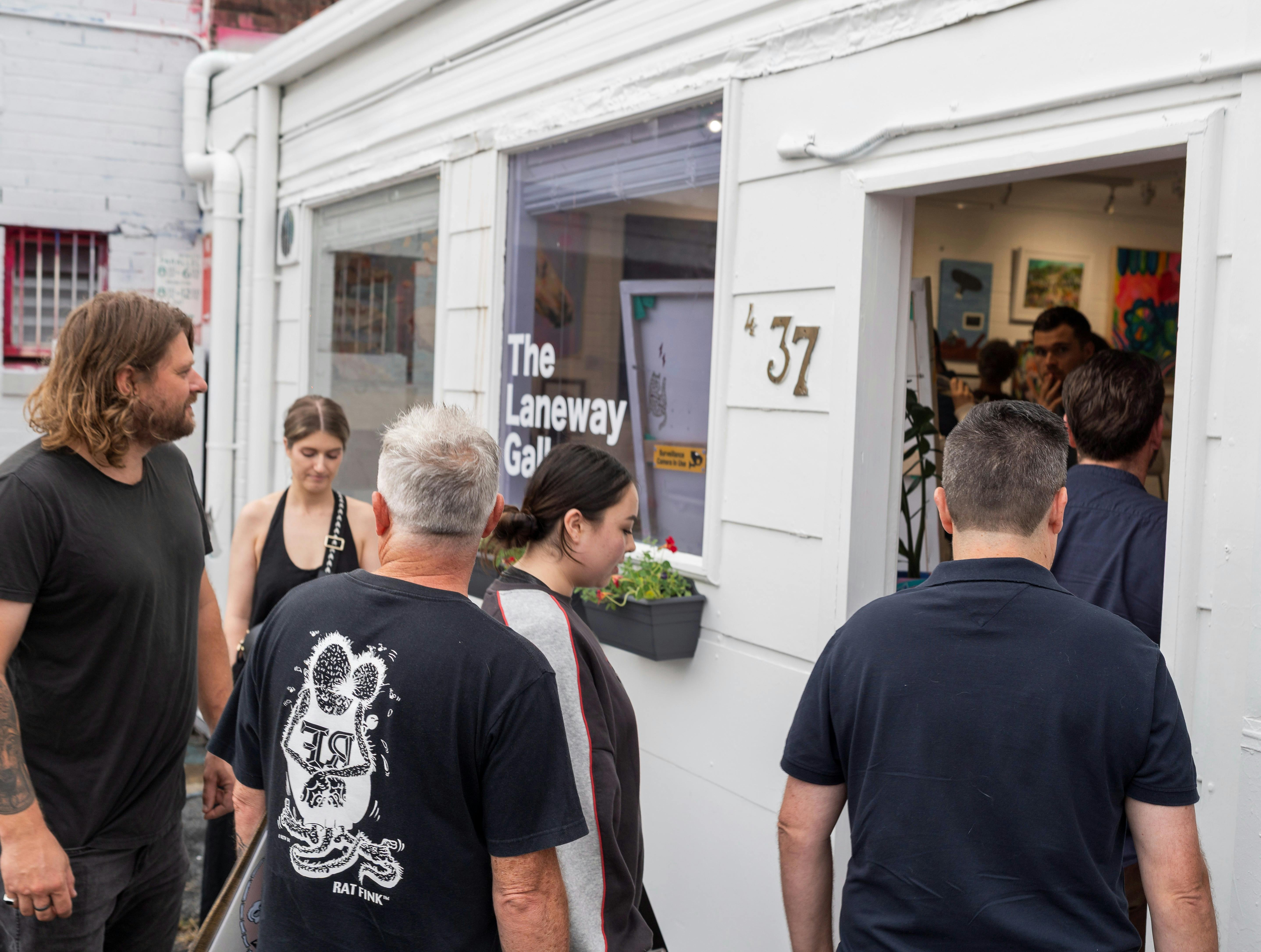 Guests arriving at The Laneway Gallery opening exhibition.