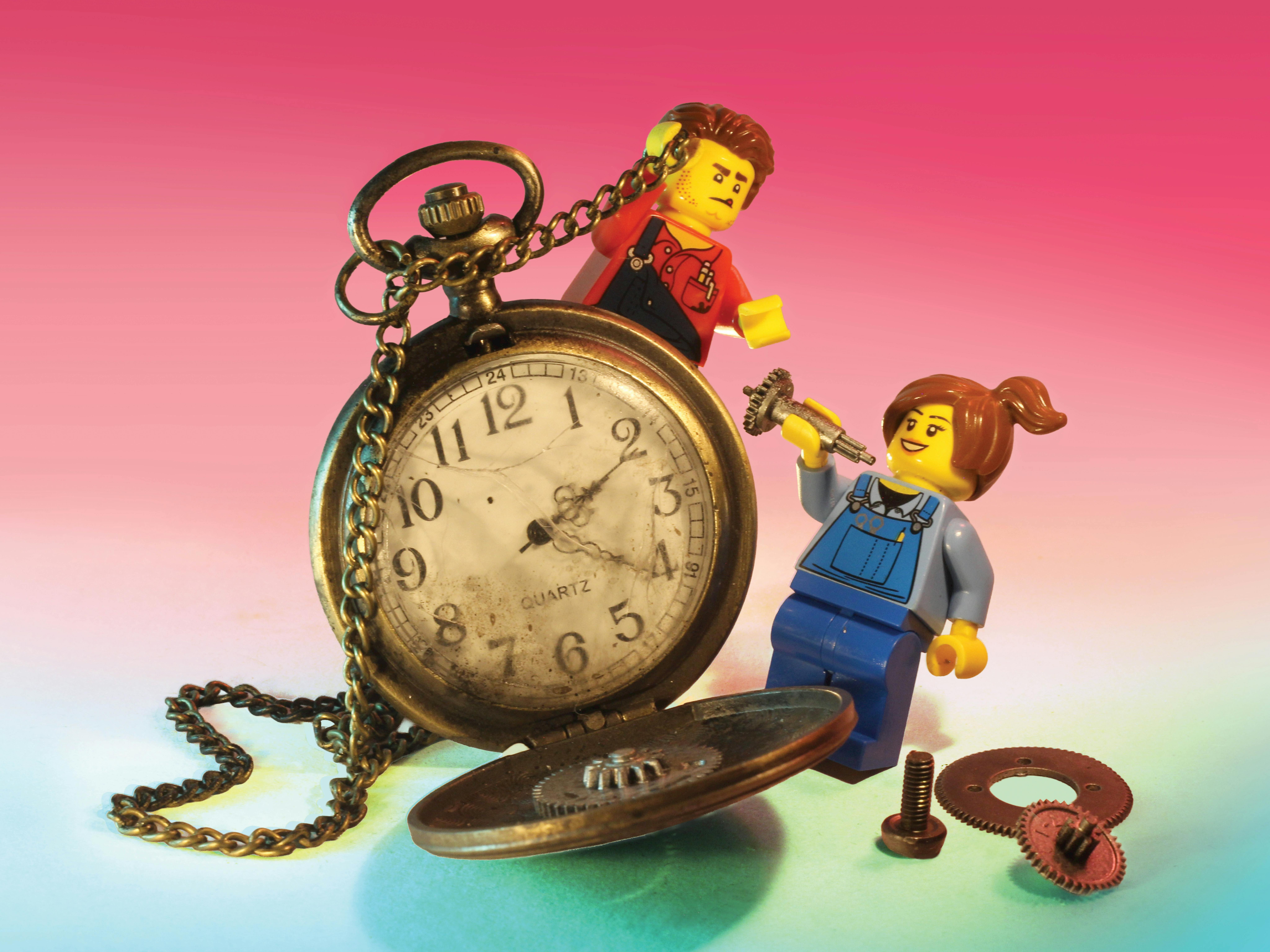 RELICS hero image featuring two miniature lego figures interacting with vintage stopwatch