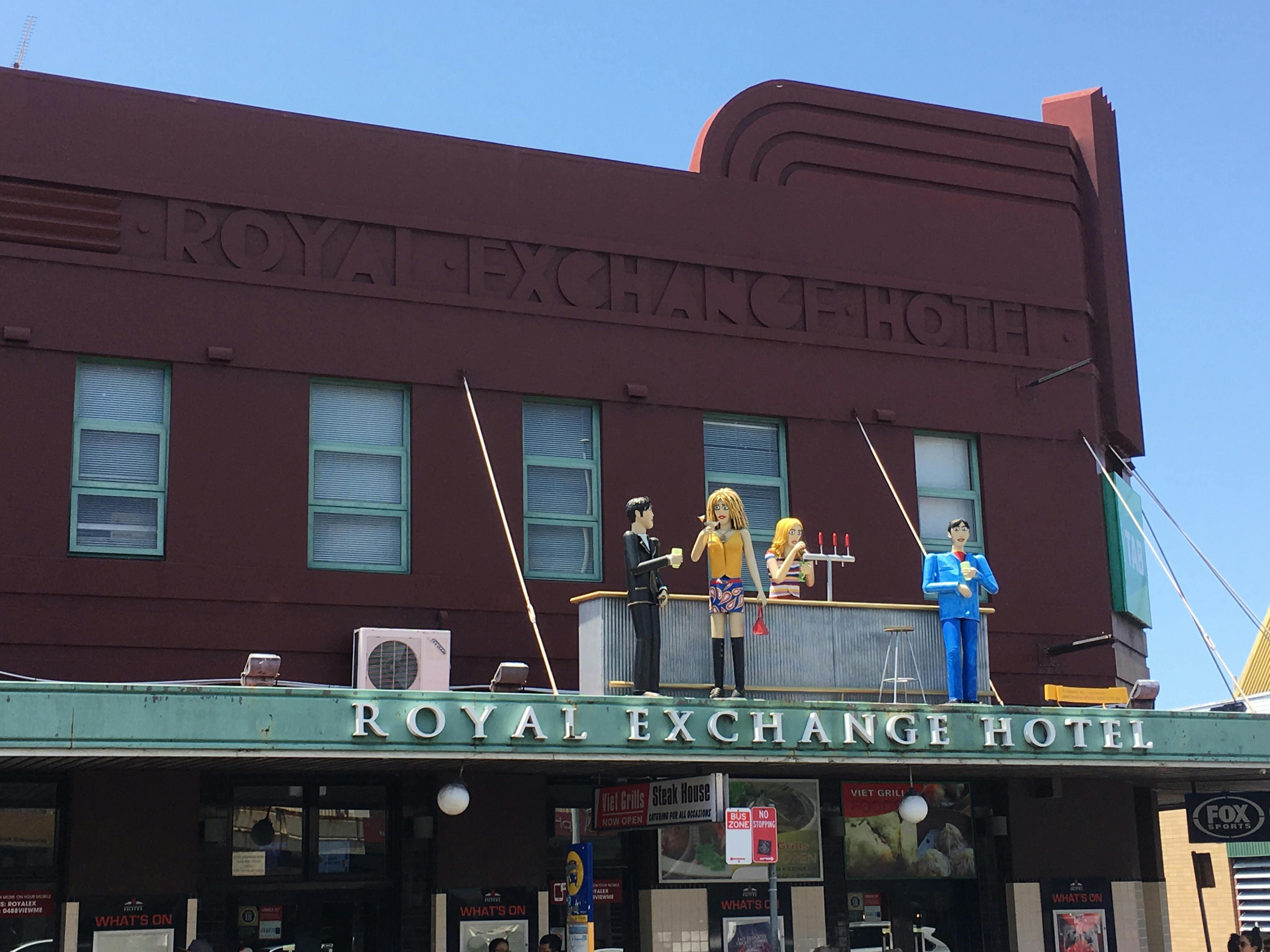 ID an awning sculpture showing people at the bar