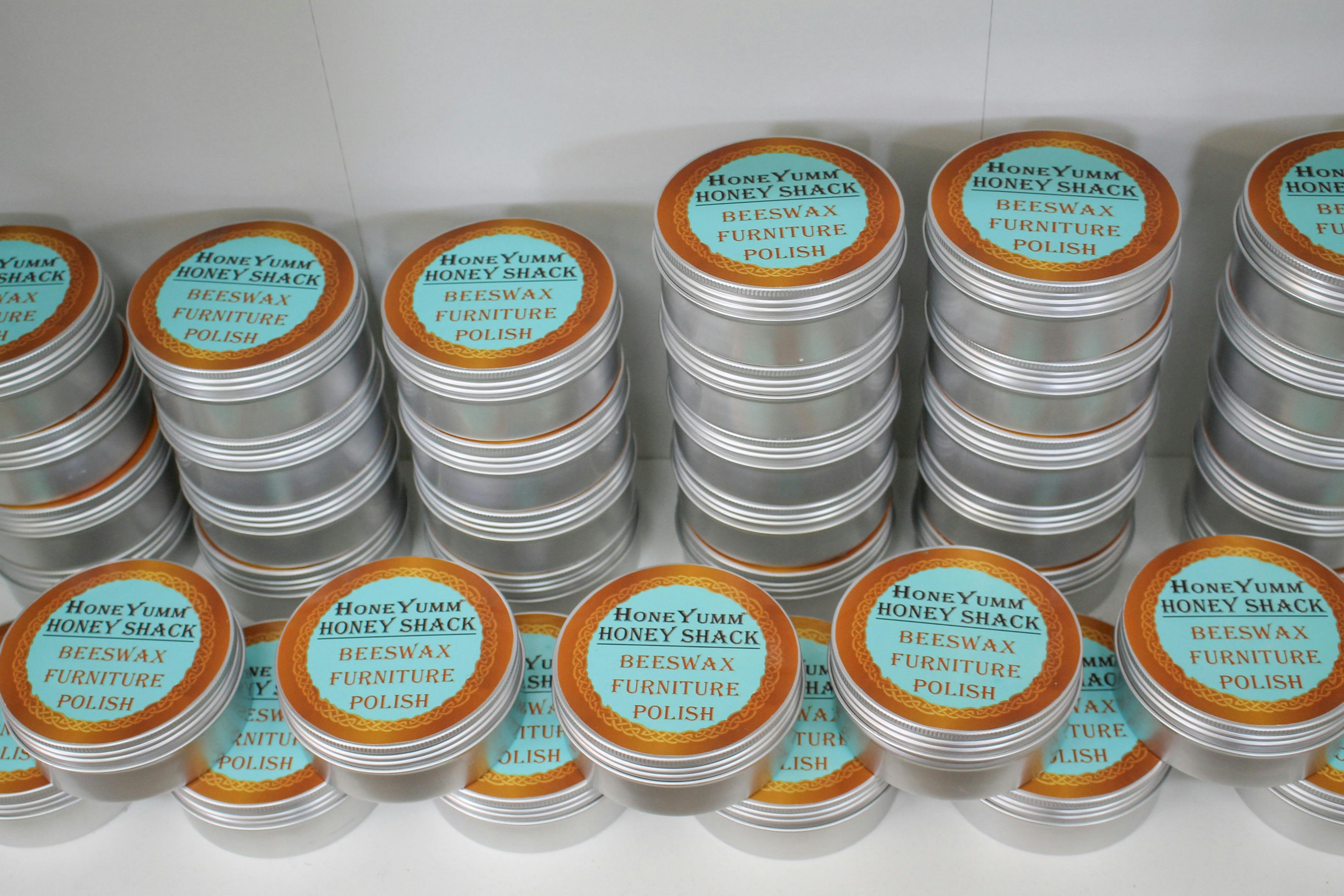 Tins of beeswax furniture polish