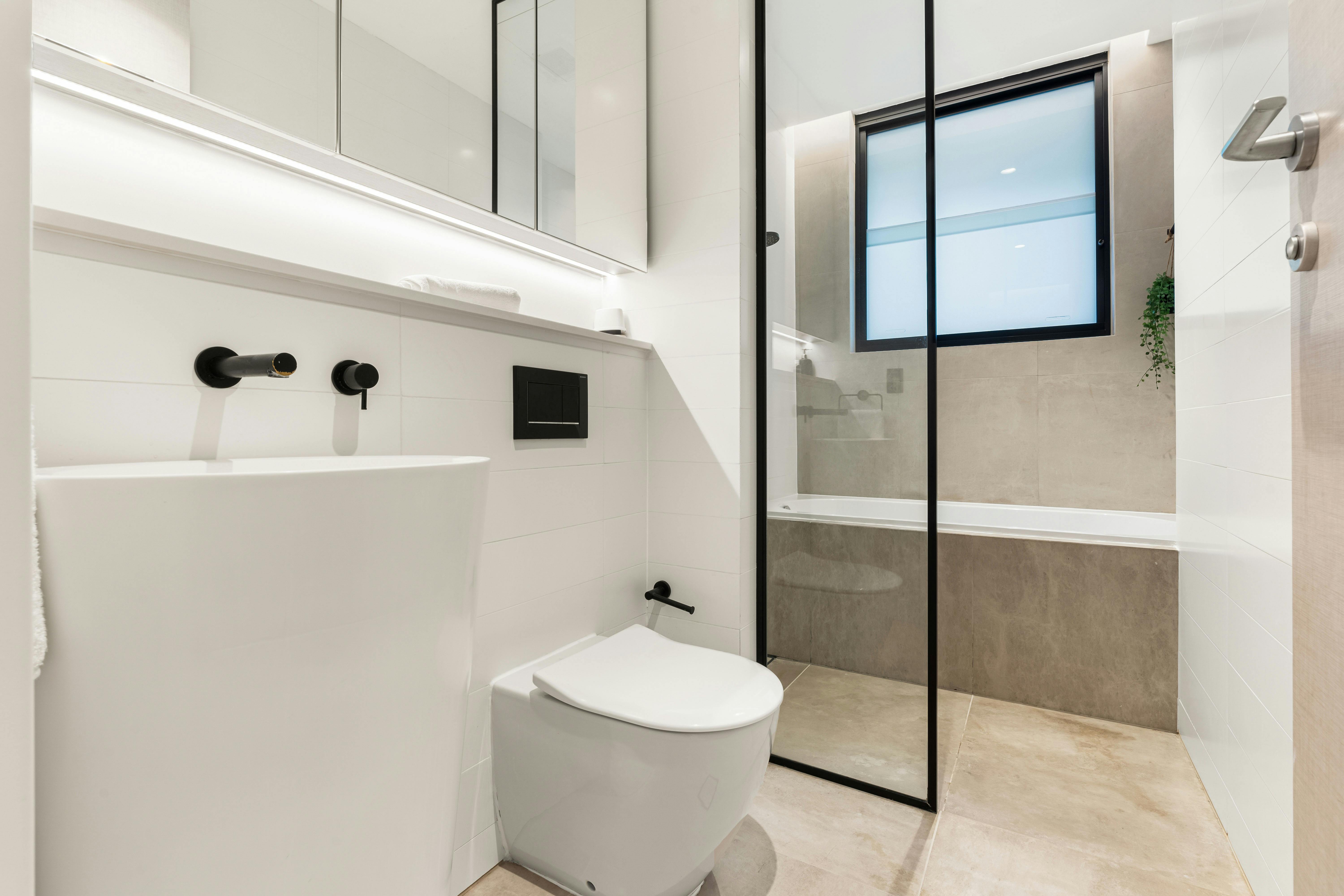 Contemporary bathroom with a glass shower and sleek fixtures.