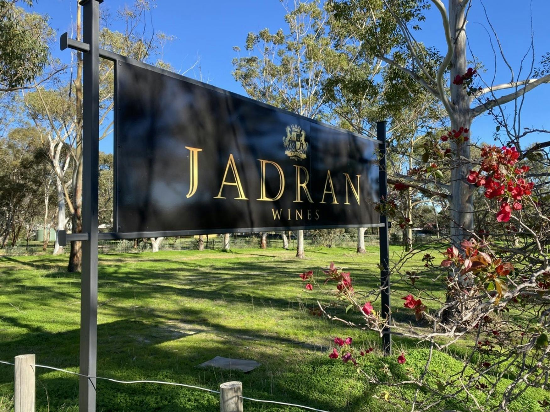 Jadran Wineries sign over looking acreage during winter