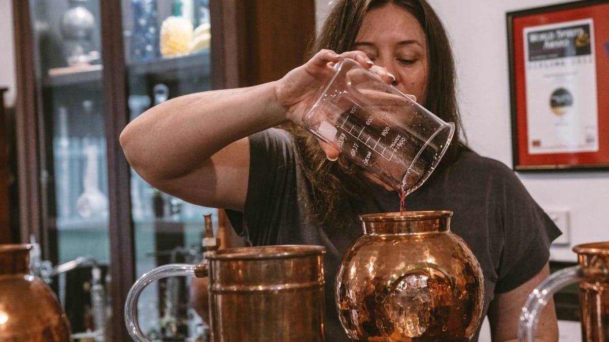 spirit making class pouring in still spirit making class pouring in still