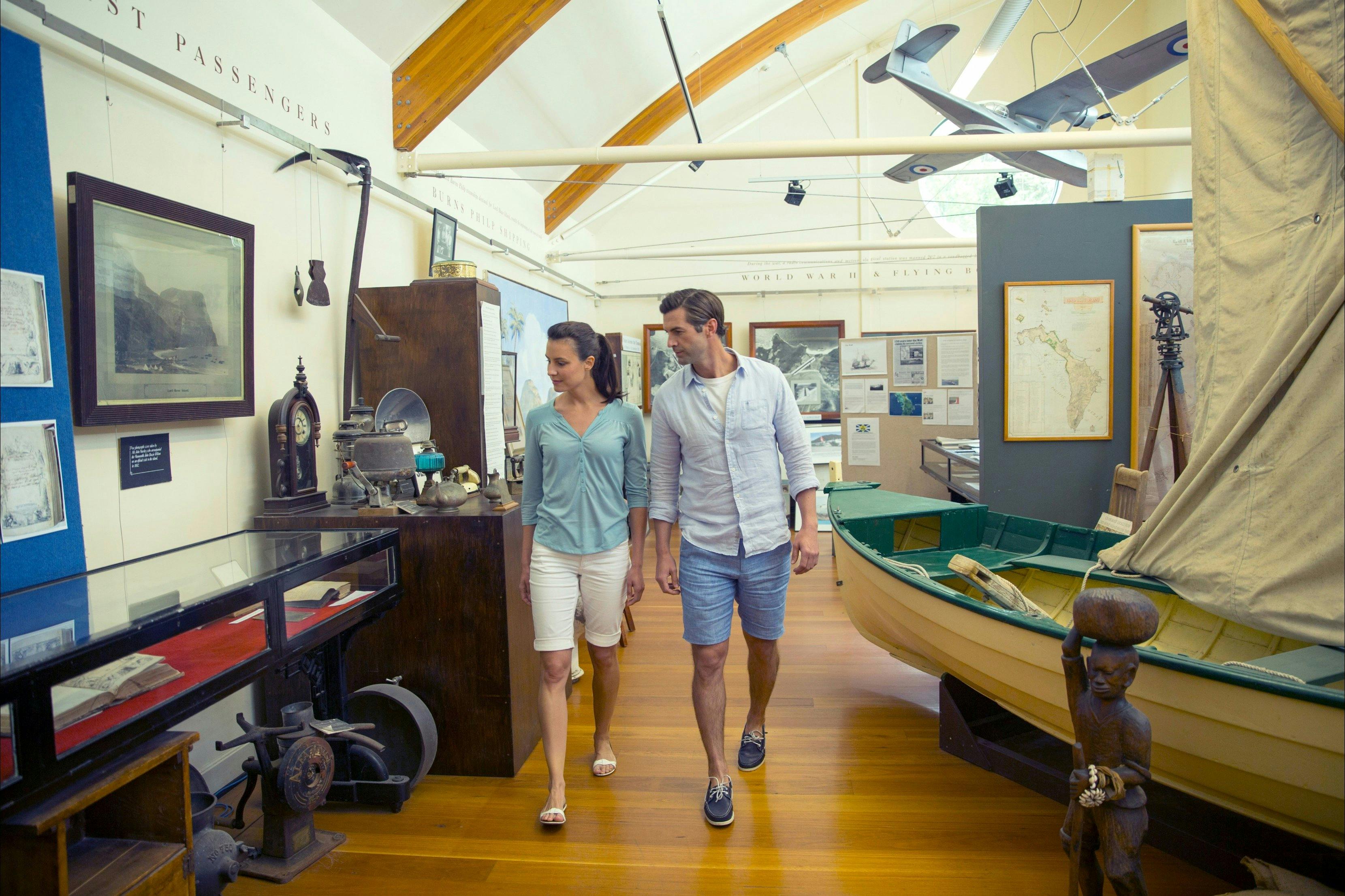 Couple viewing the historic artifacts major collection on a visit to the Lord Howe Island Museum