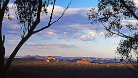 View with mountain peaks in distance.
