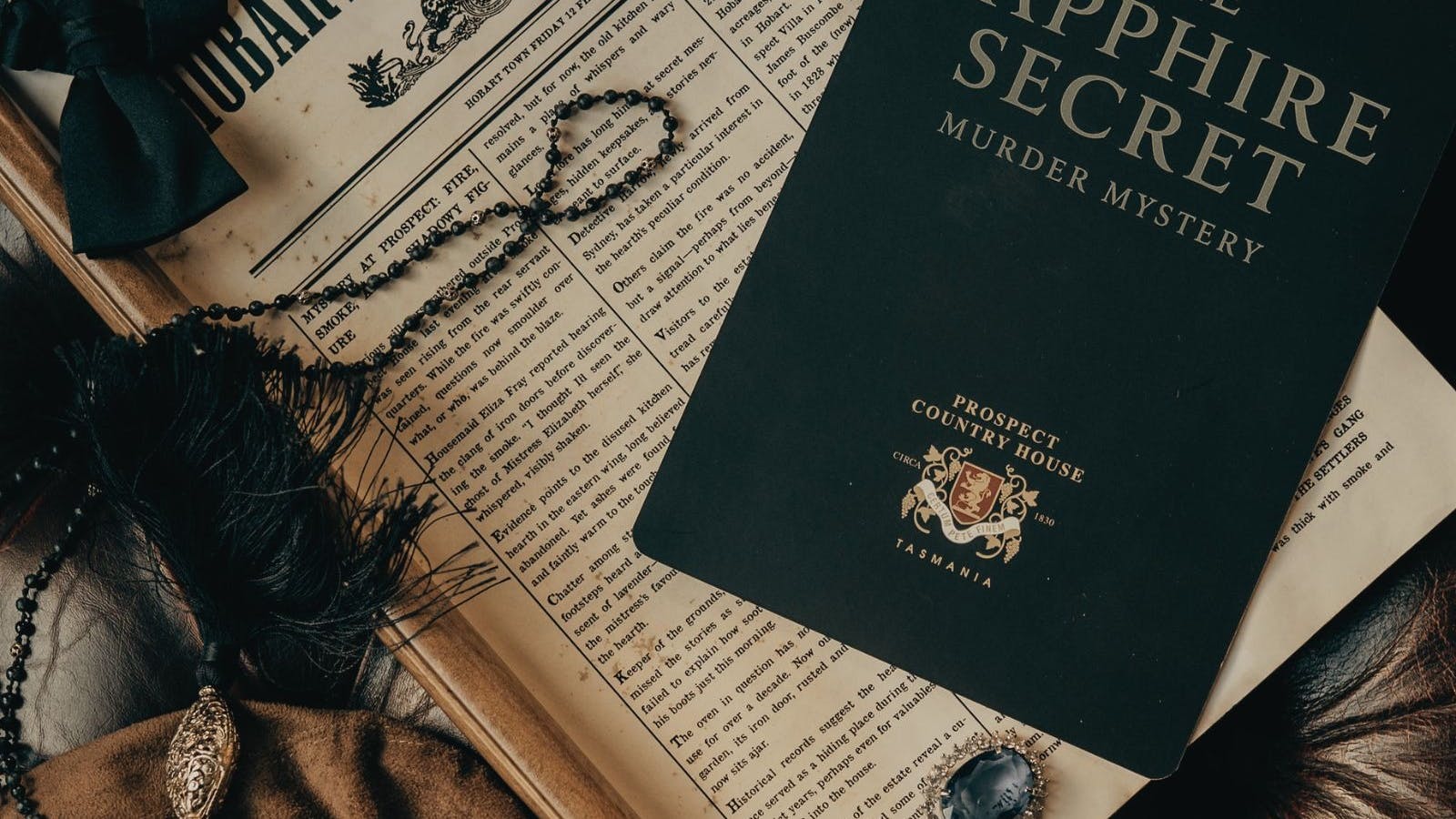 Murder Mystery Invitation with jewells and an 1860's Newspaper