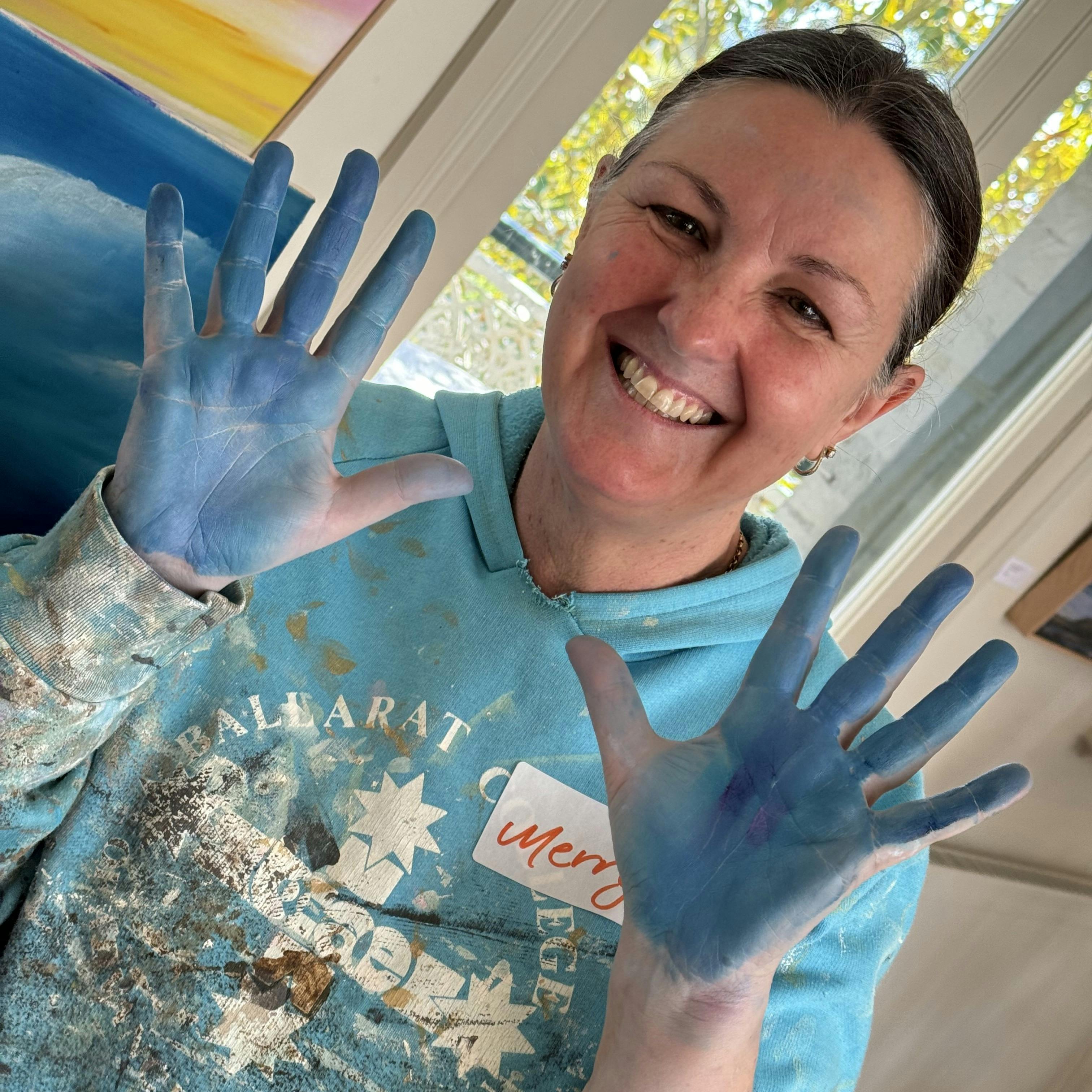 participant with blue hands