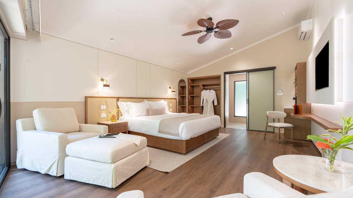 Nala Resort's luxurious Studio Suite - king bed, lounge chairs and ottomans, desk and mini bar