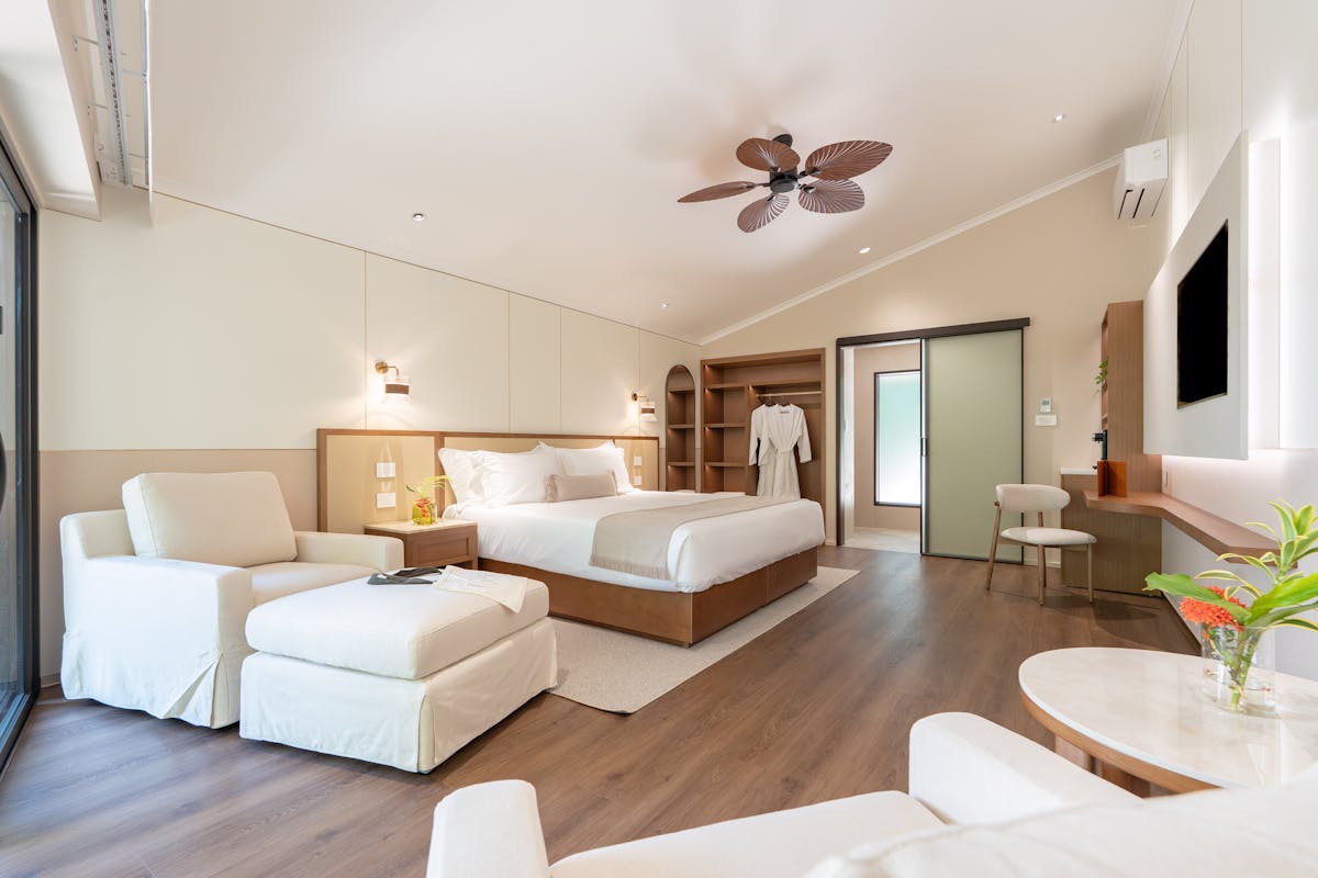 Nala Resort's luxurious Studio Suite - king bed, lounge chairs and ottomans, desk and mini bar
