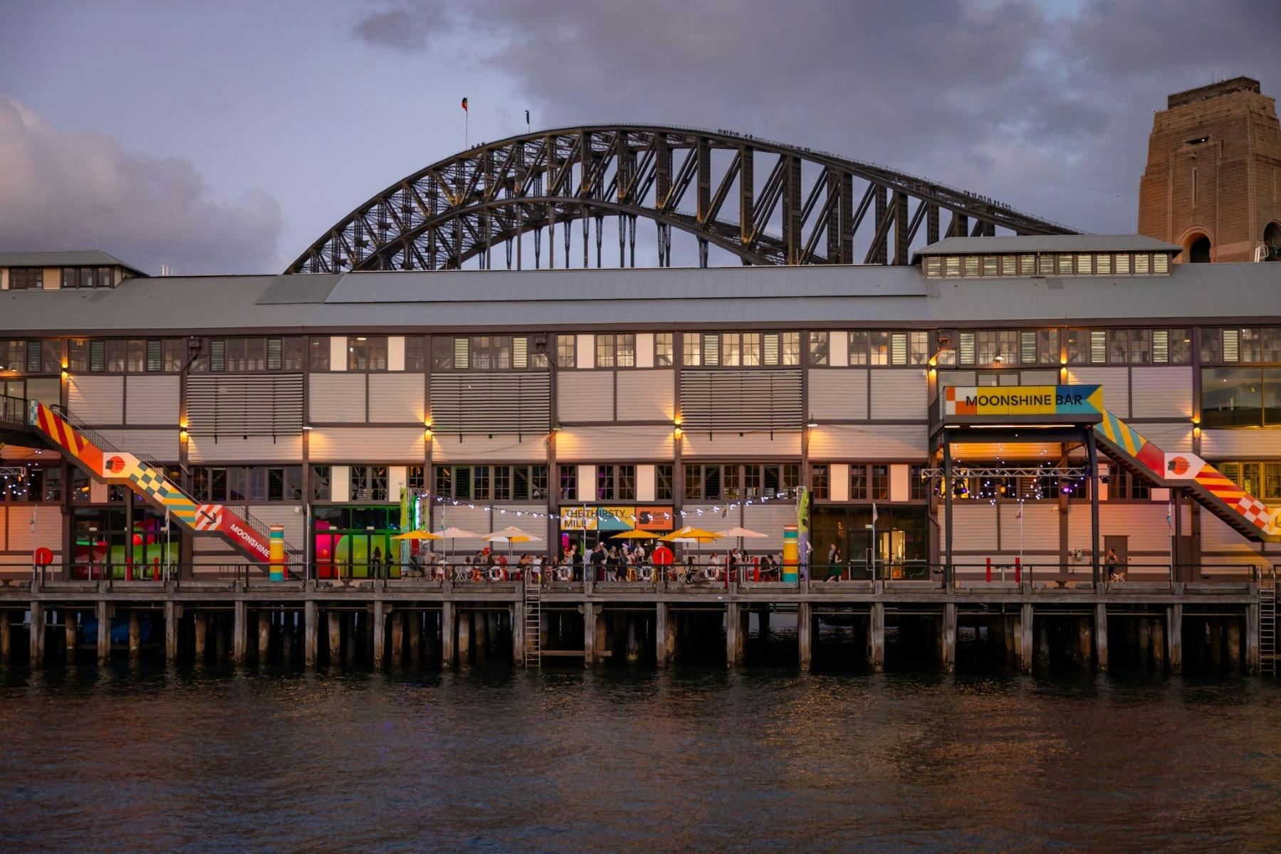 A building in the foreground, complemented by the Sydney Harbour bridge in the background
