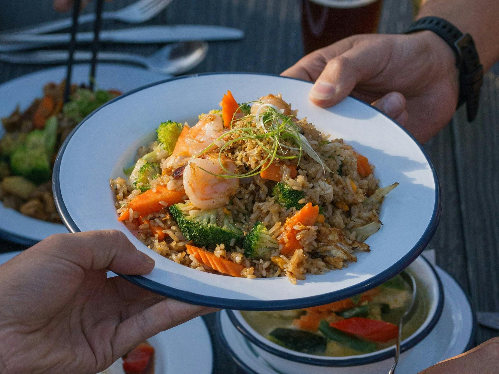 A plate of prawn fried rice with vegetables at Easy Tiger in St Helens.