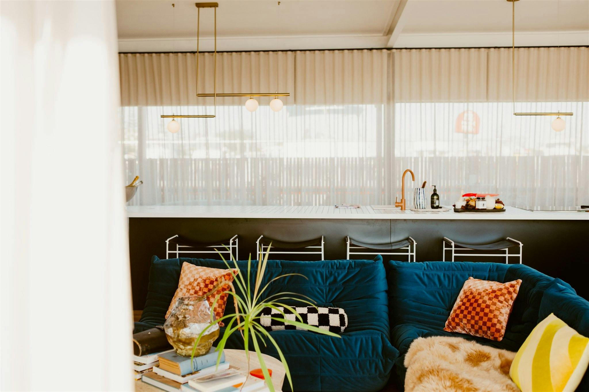 idle couch and kitchen in the background