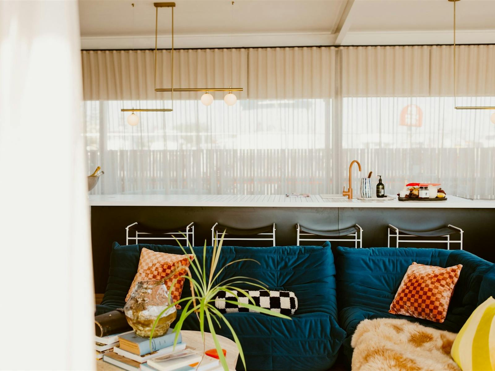 idle couch and kitchen in the background