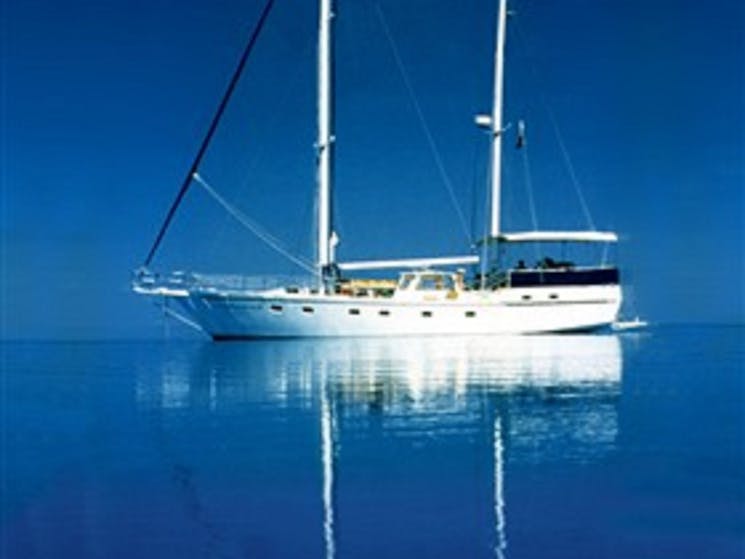 luxury sailing yacht with lots of room for relaxing on deck.  Full awning protects in all weather