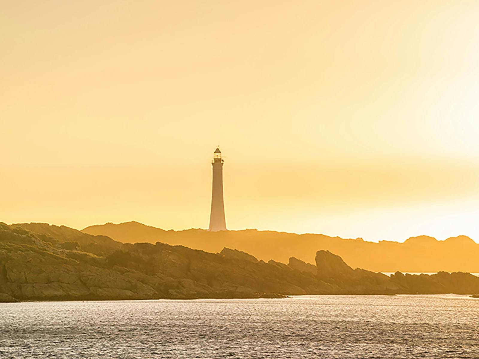 Cape Sorell Lighthouse at sunset.
