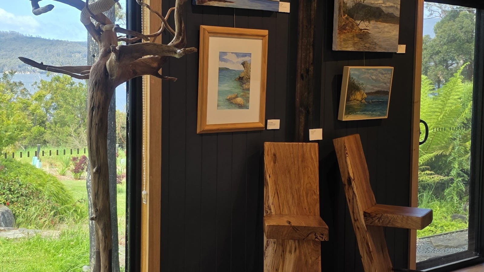 Timber barstools, driftwood hatstand, watercolour and oil paintings