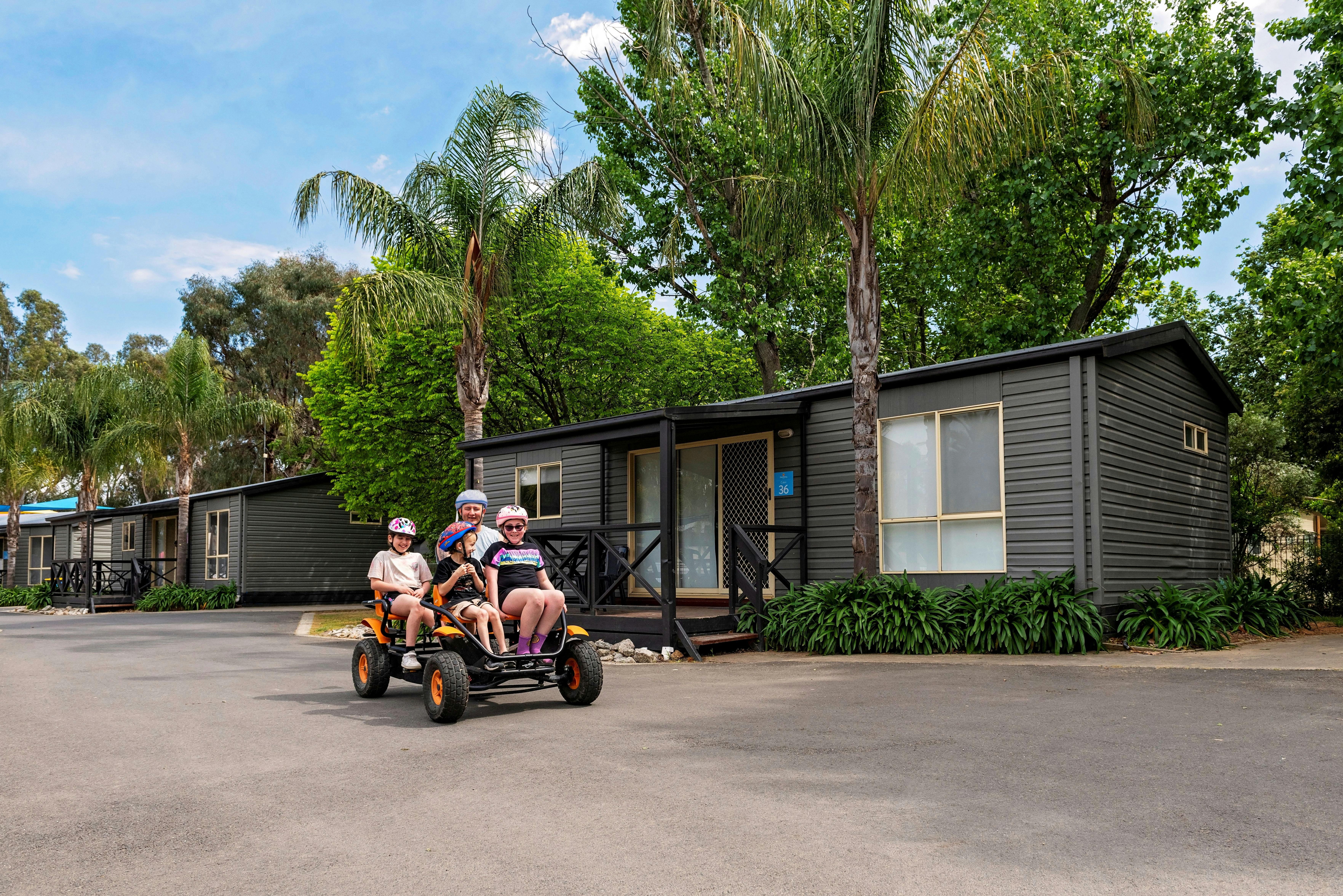Family riding bikes at Discovery Parks - Maidens Inn, Moama