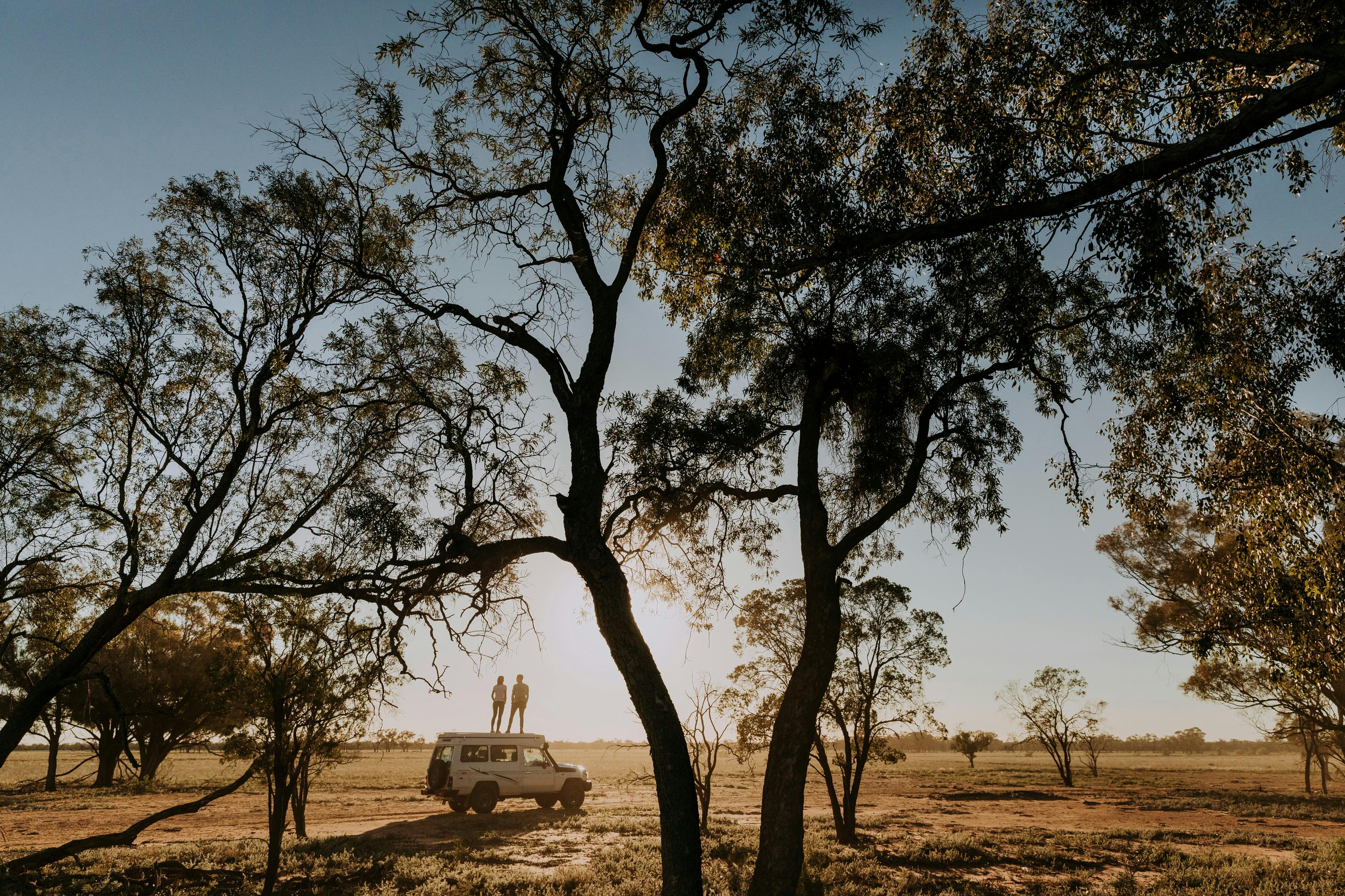 People standing on top a vehicle at Shearer's Campsite at Charlotte Plains, Outback Queensland
