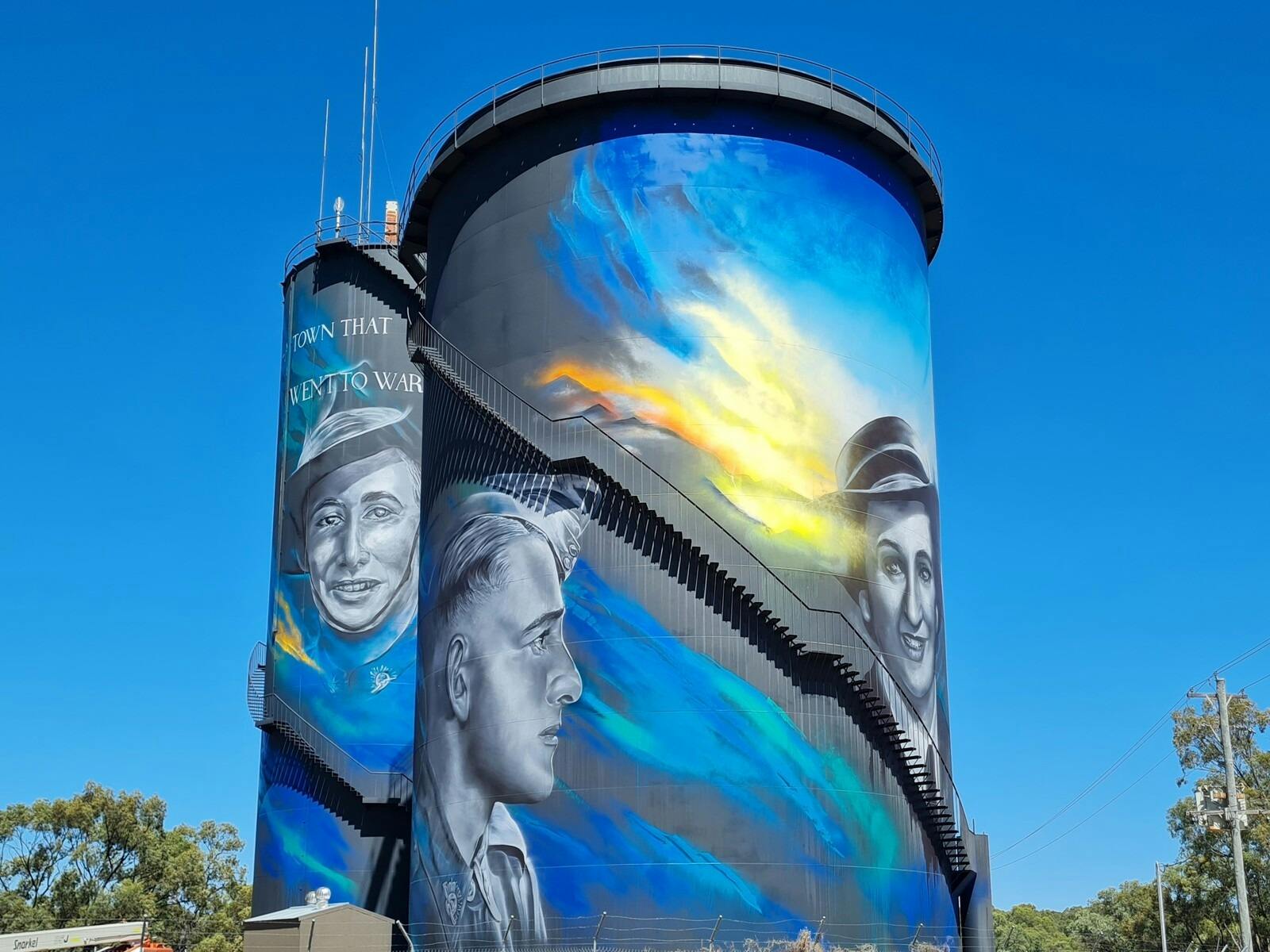 View of two returned serviceman on Hay Water Tower Art