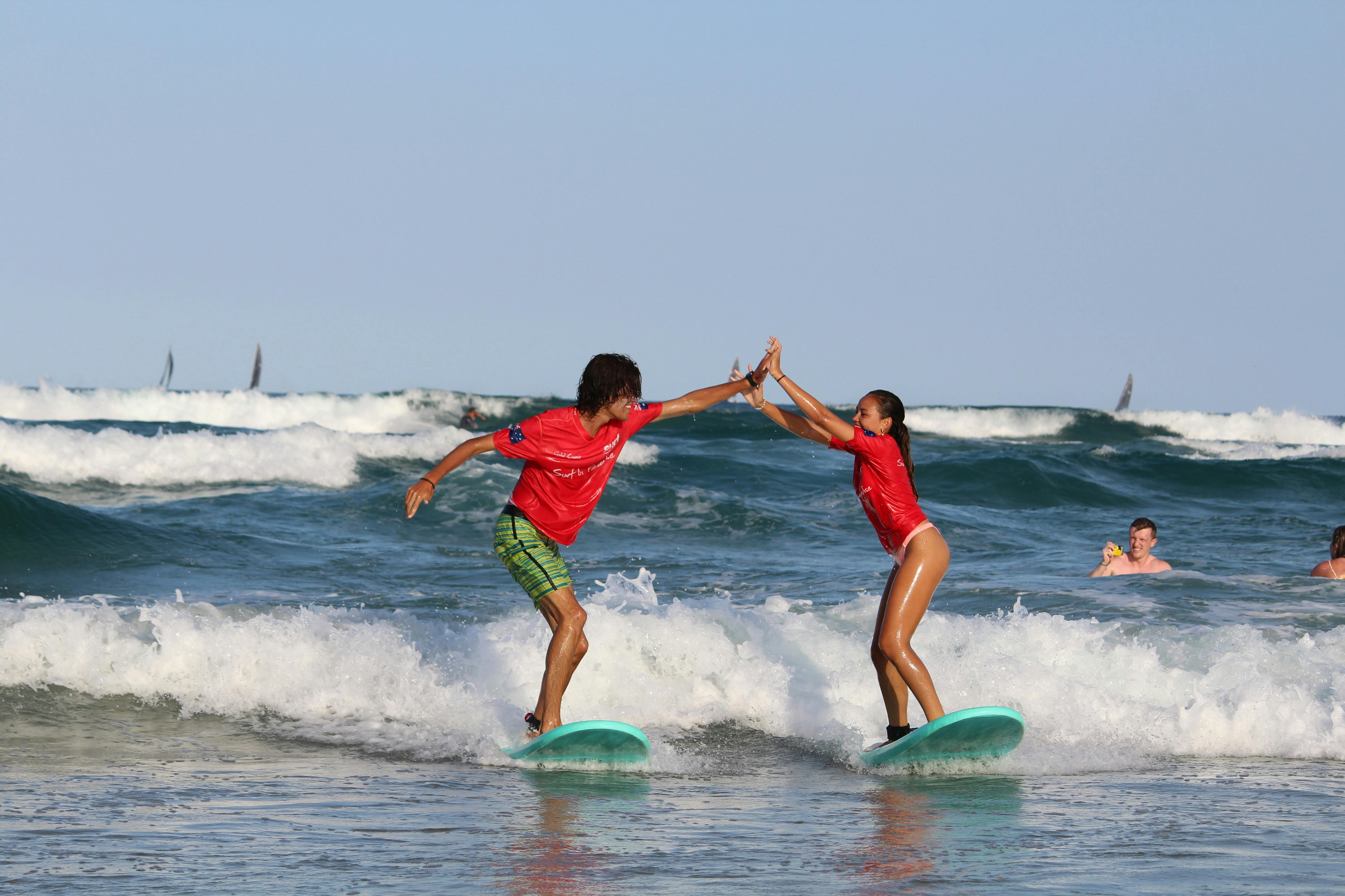 A couple having fun in a surf lesson