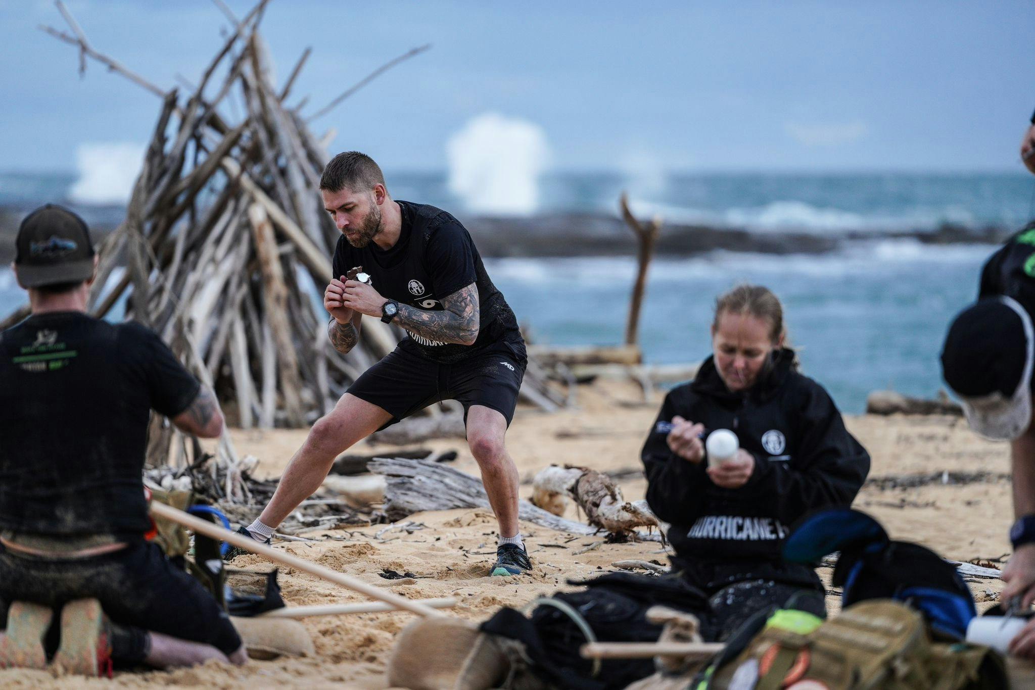 A group of competitors solve puzzles together.