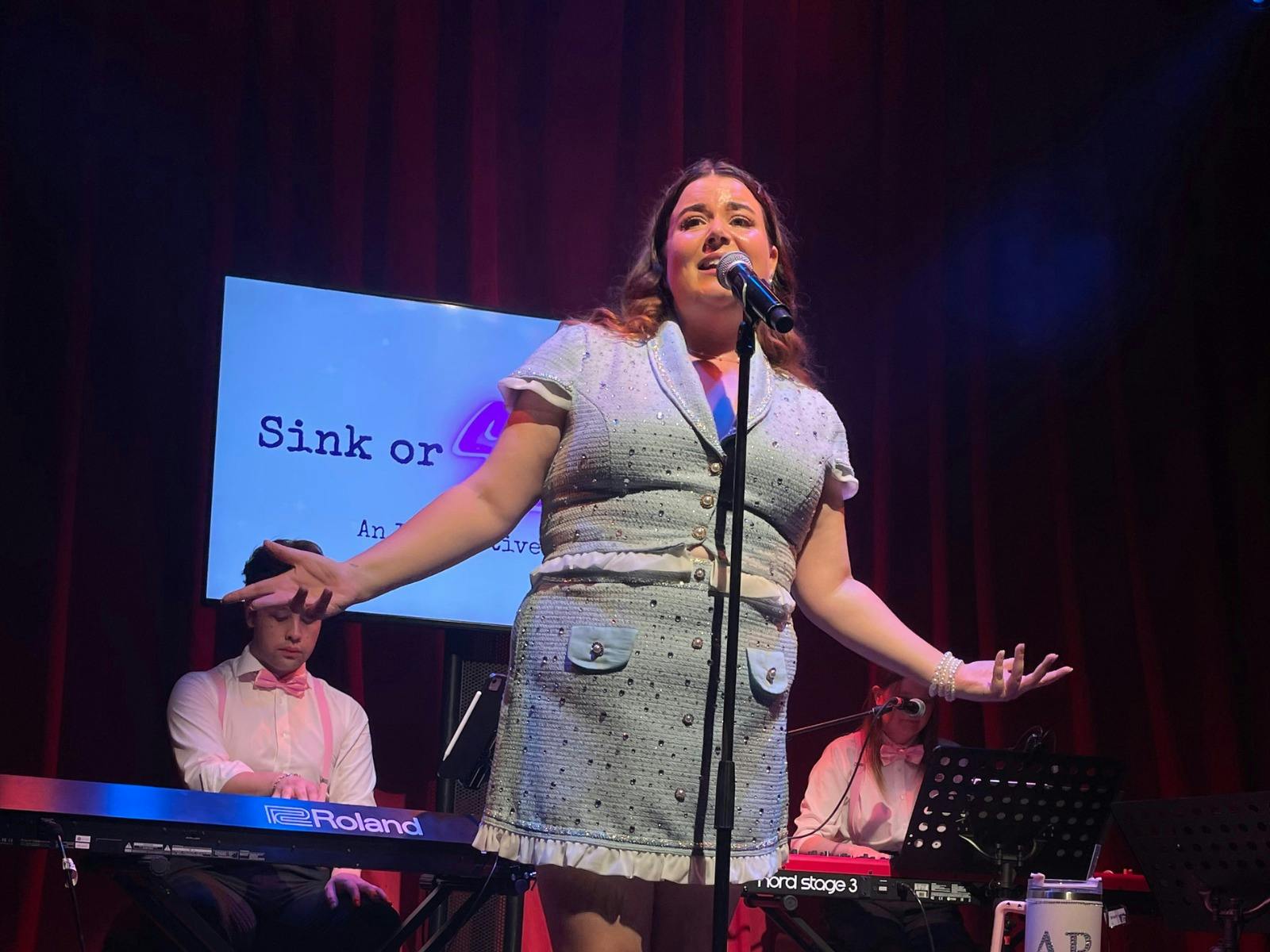 A singer standing on stage