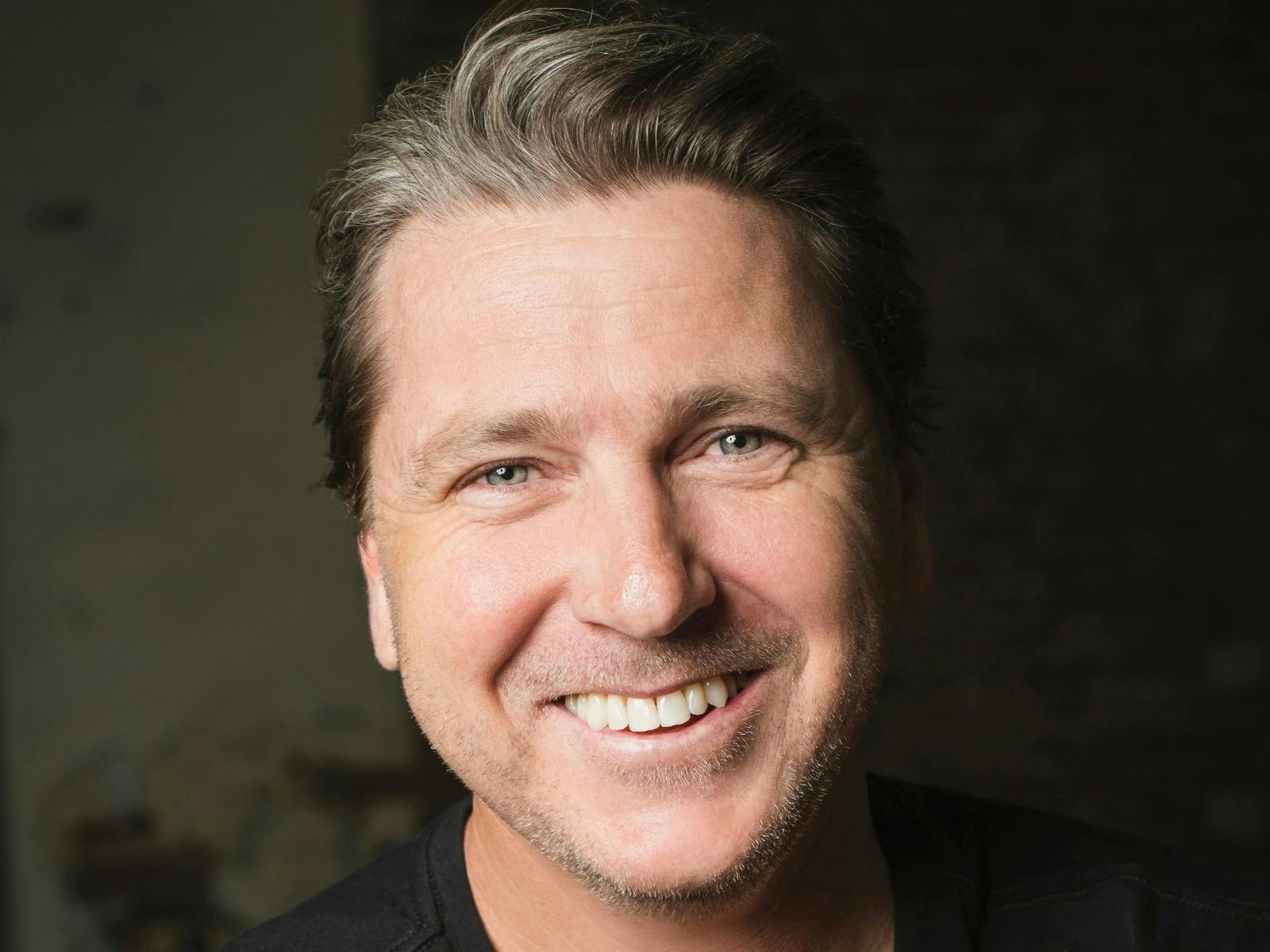 close up man clean shaven smiling face