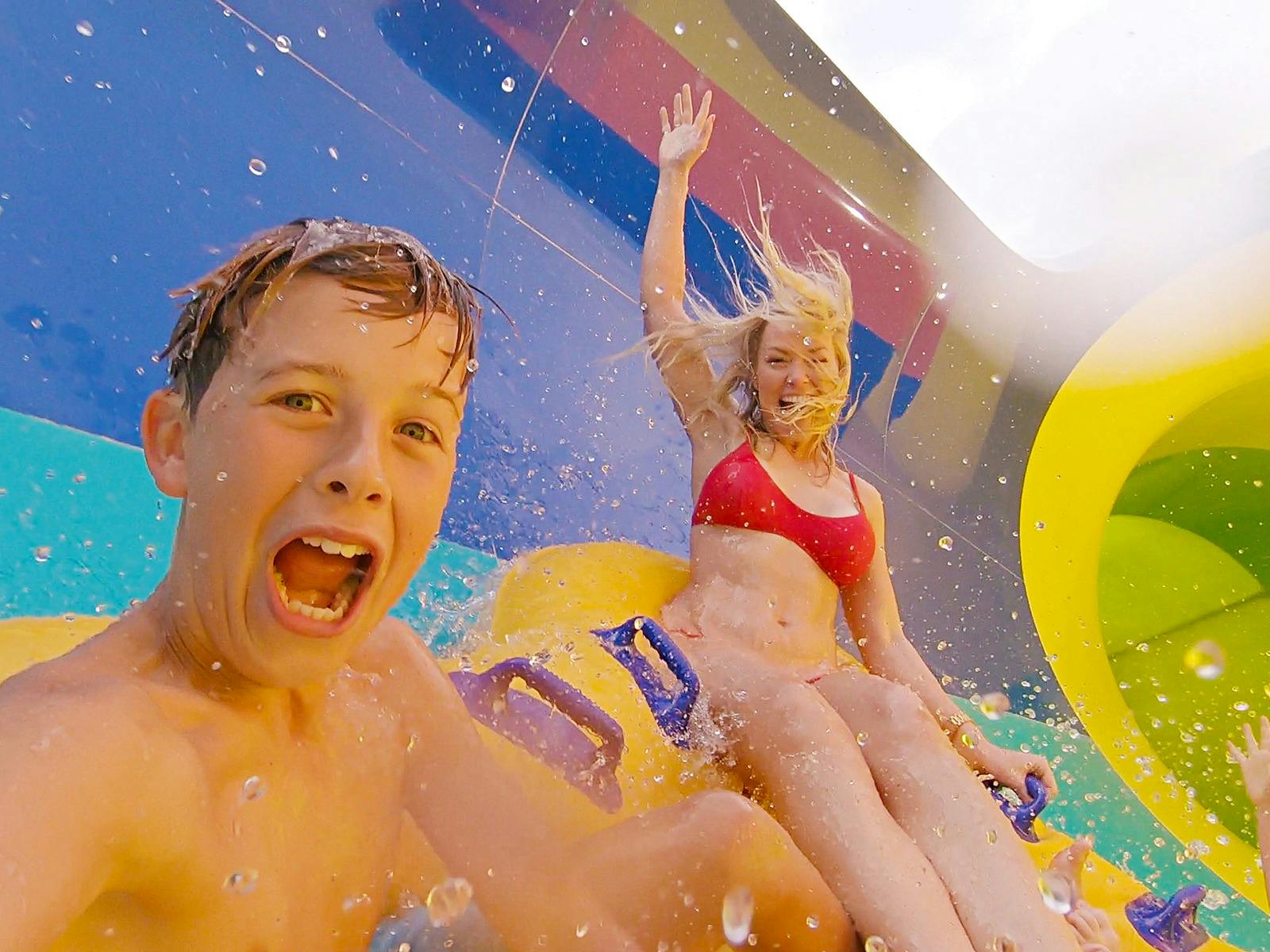 mum and boy riding the Tsunami waterslide