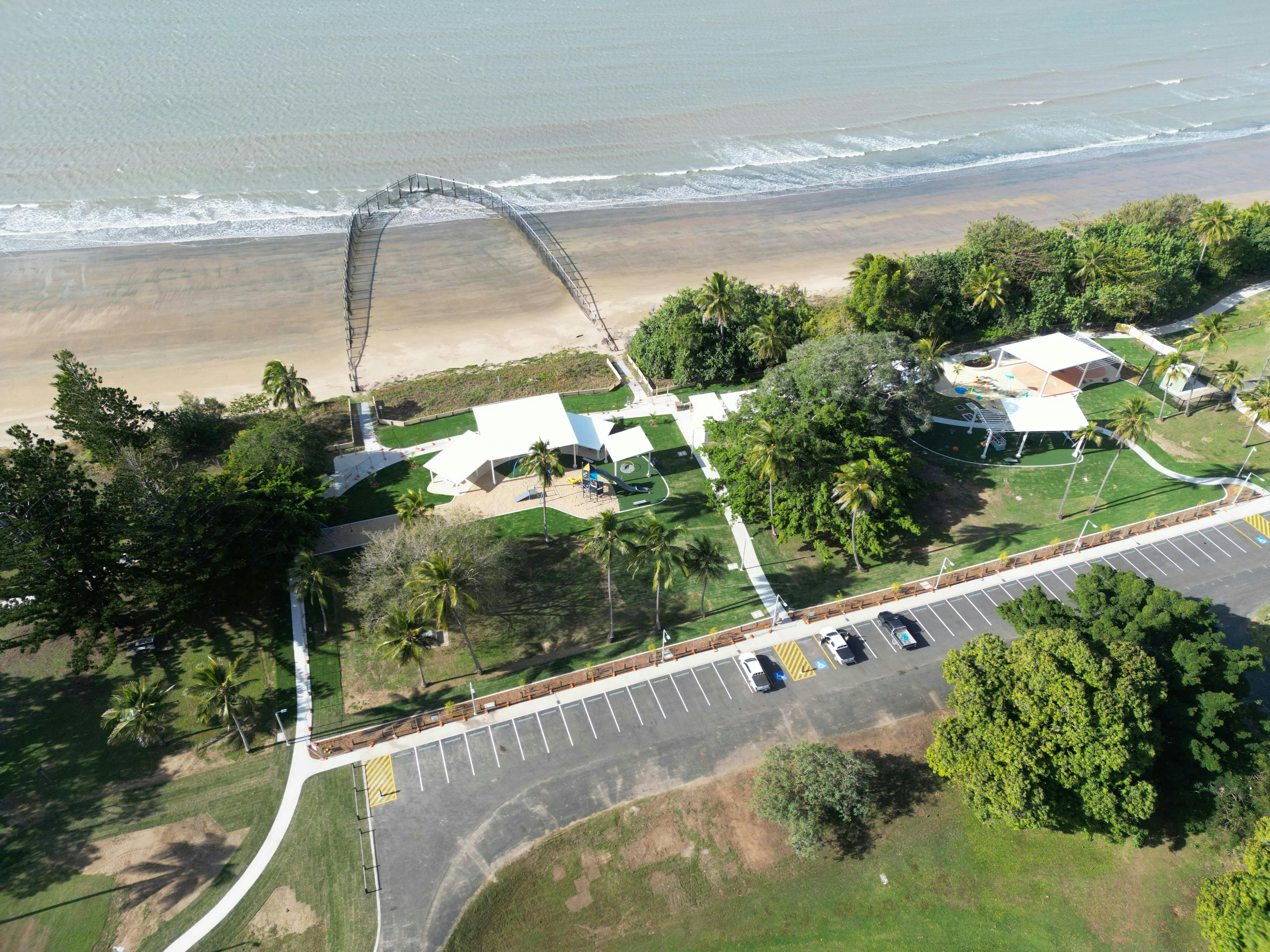 Seaforth Esplanade, swimming enclosure, ocean in the background, the carpark.
