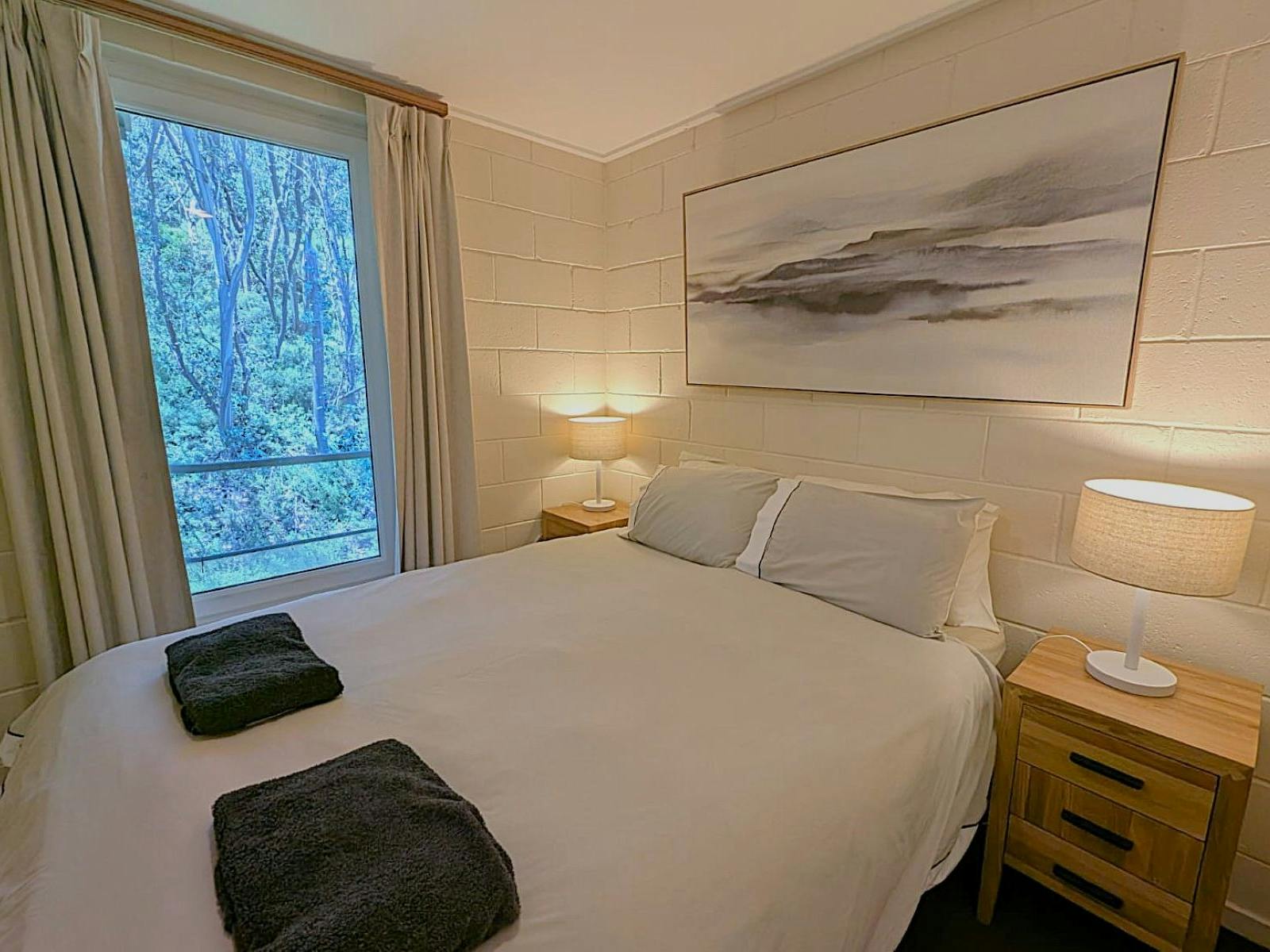 Cosy bedrooms looking out to the trees