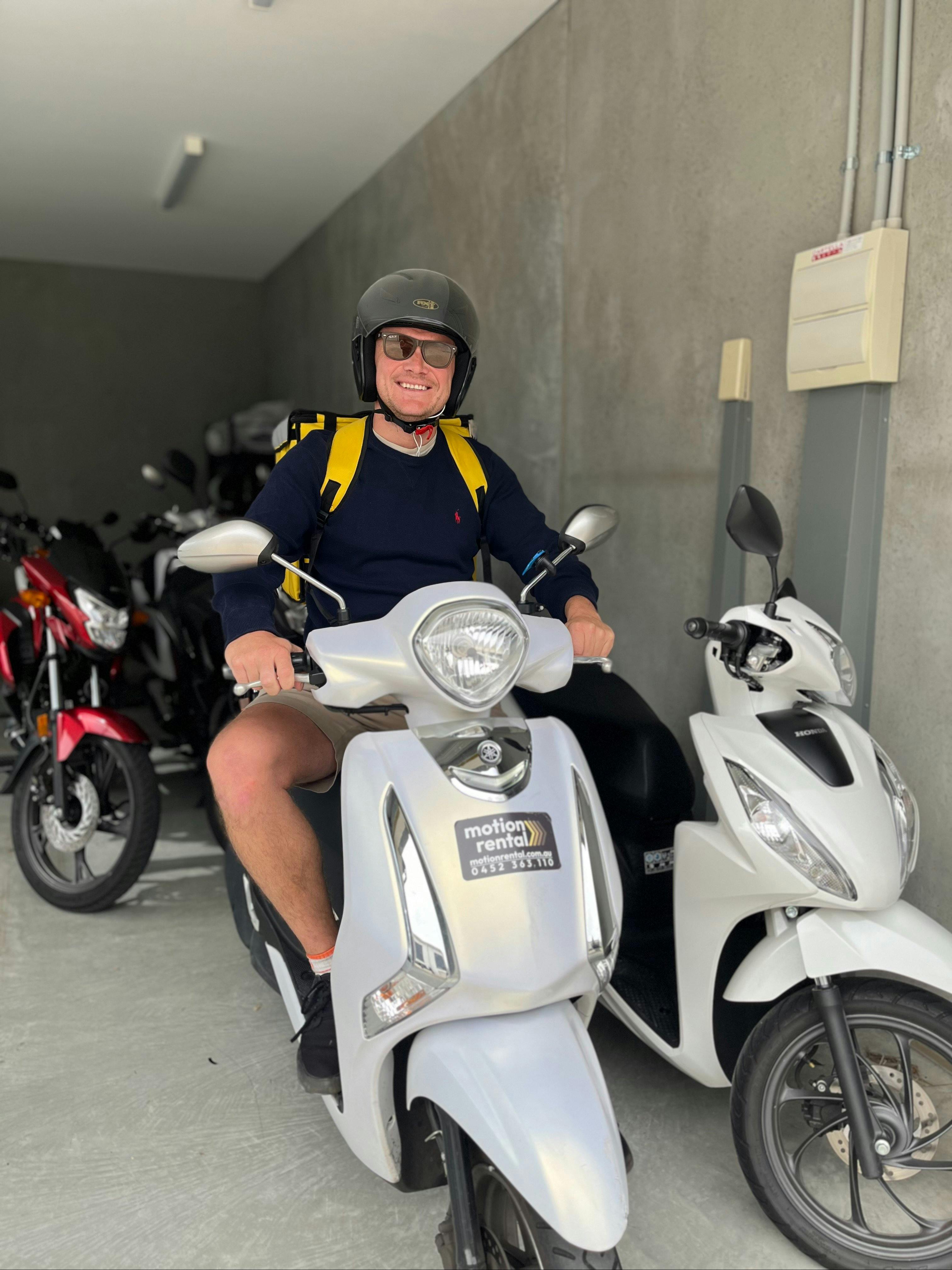 Customer renting scooter with Motion Rental