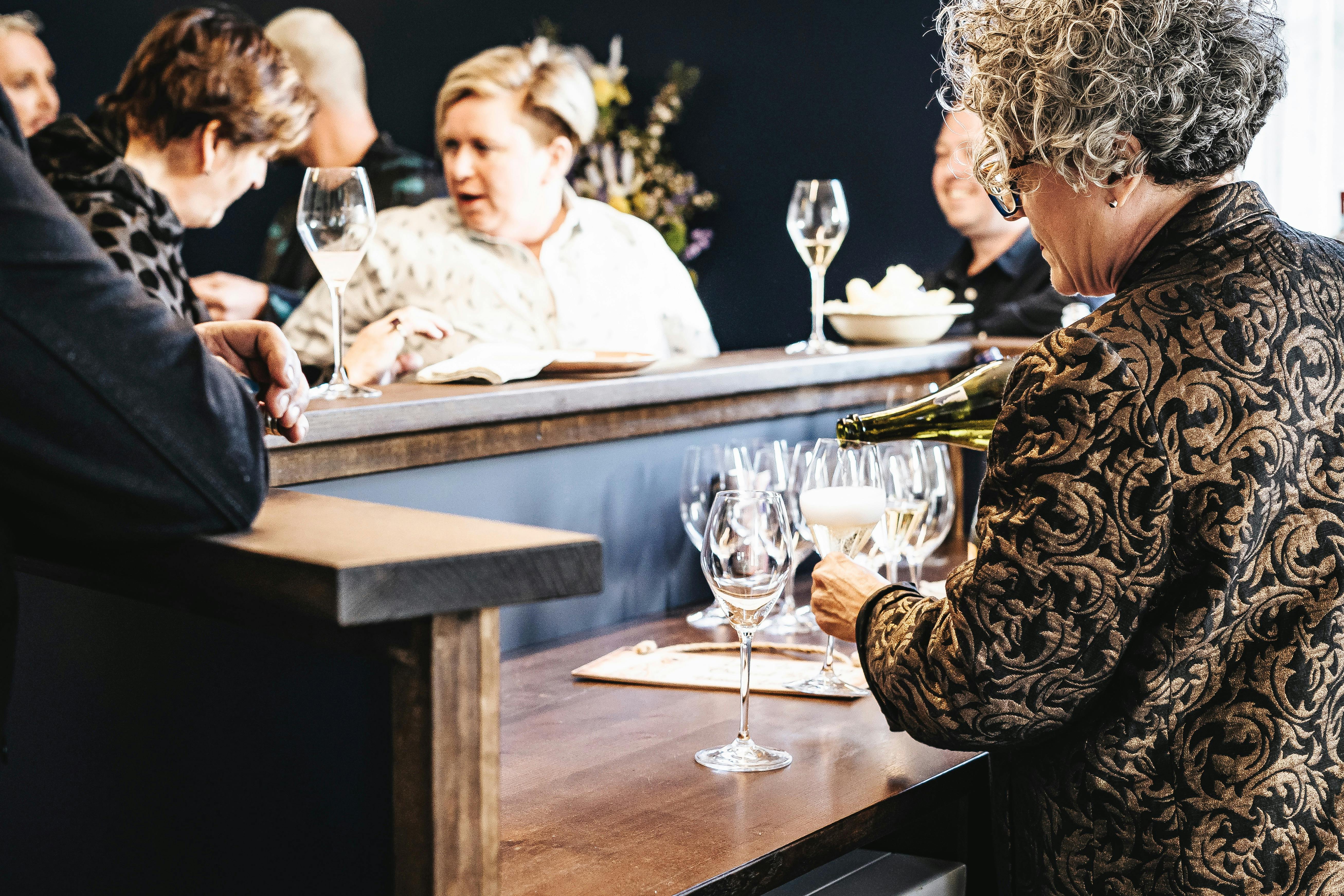 Wine Bar in Action.  Lucy pours drinks for guests.