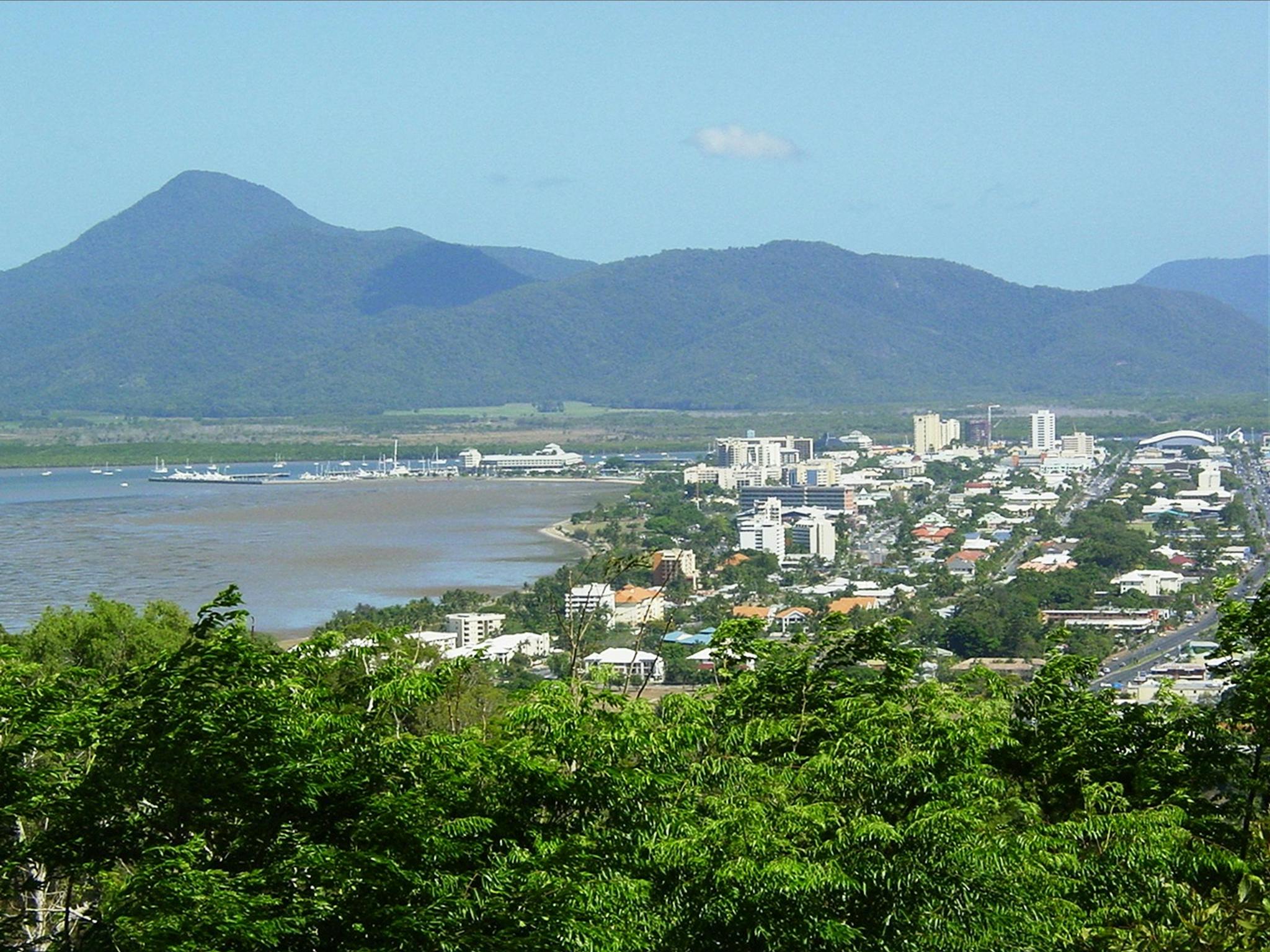 Elevated view of Cairns city, Trinity Inlet and mountains in background. Elevated view of Cairns city, Trinity Inlet and mountains in background.