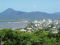 Elevated view of Cairns city, Trinity Inlet and mountains in background.