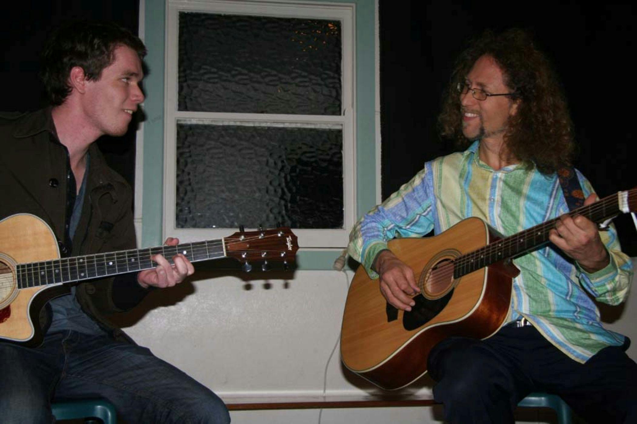 Rous Unplugged at Rous Mill Hall people playing guitar and singing