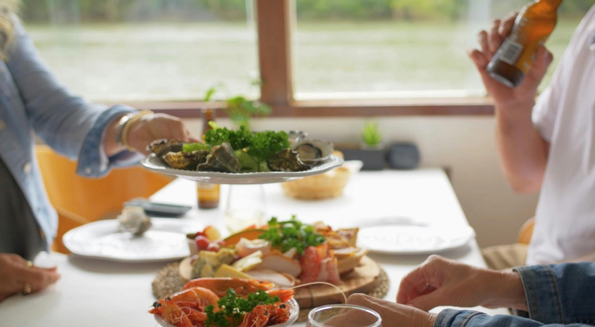 Oysters, prawns and local food board.