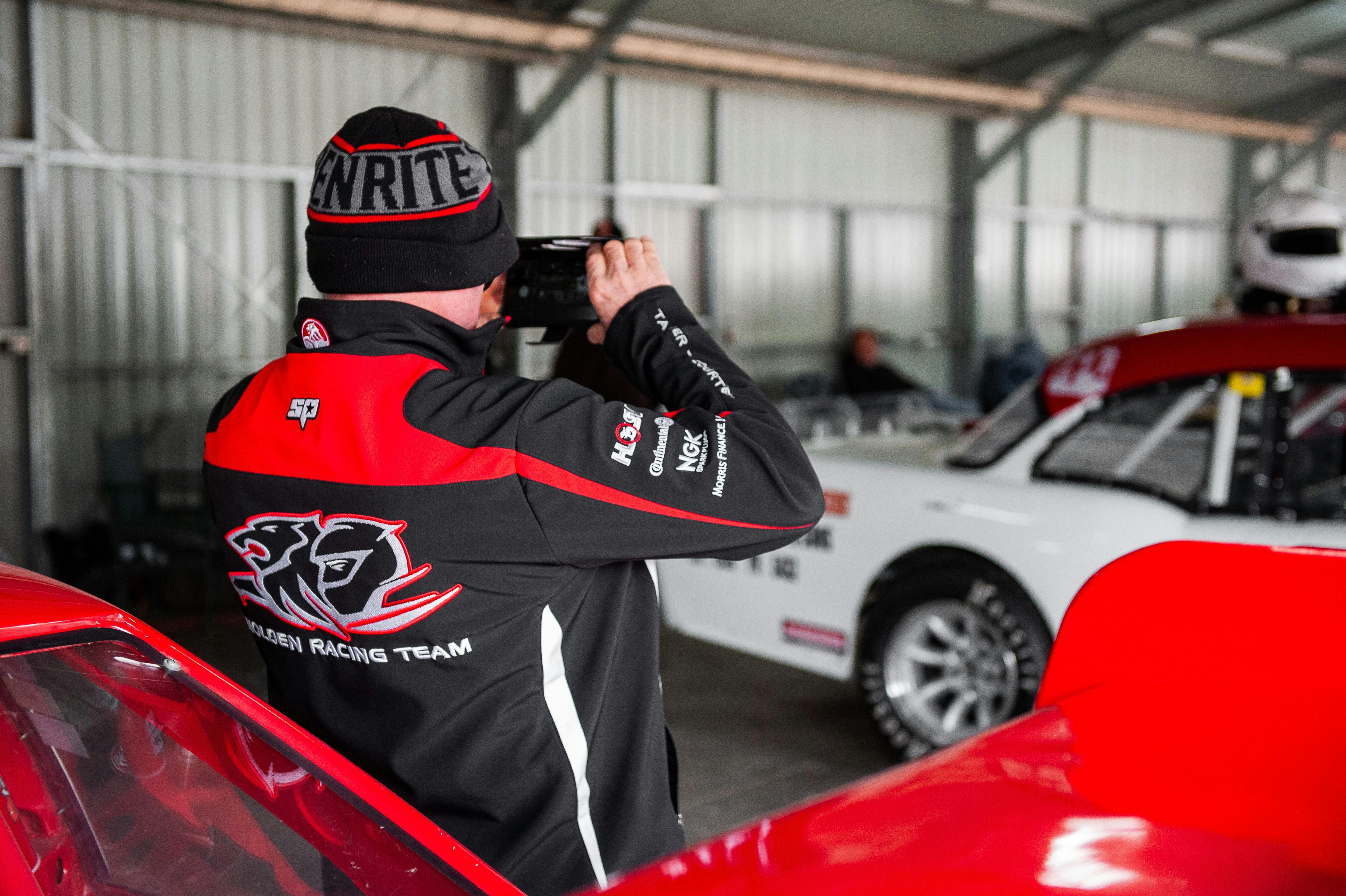 Car enthusiast taking photos